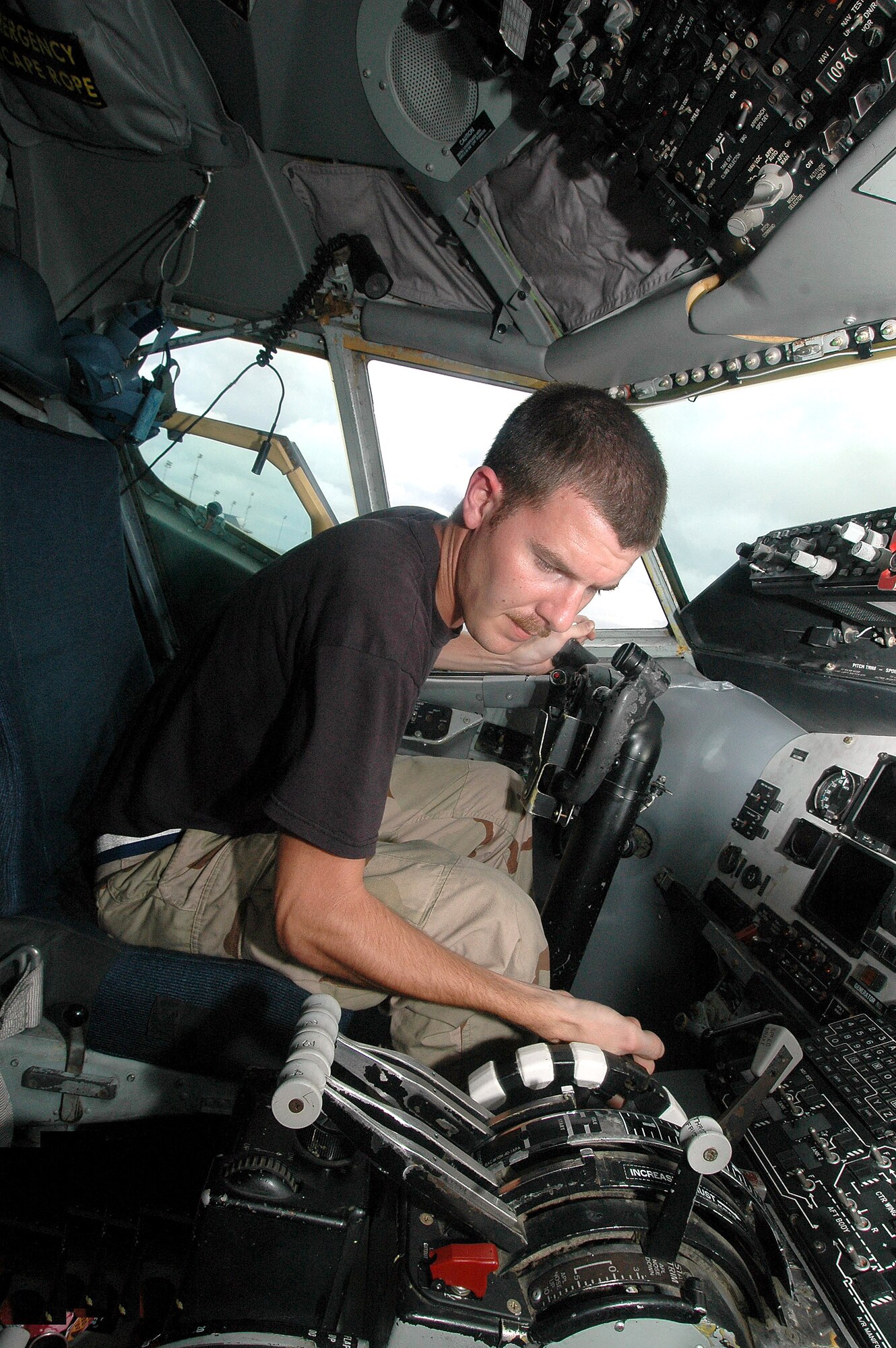 Senior Airman Tyler Main coordinates the application of external power to conduct interior and exterior checks to a KC-135 that just returned from a mission. Airman Main is a crew chief with the 28th Expeditionary Air Refueling Squadron. (U.S. Air Force photo/Staff Sgt. Doug Nicodemus)

