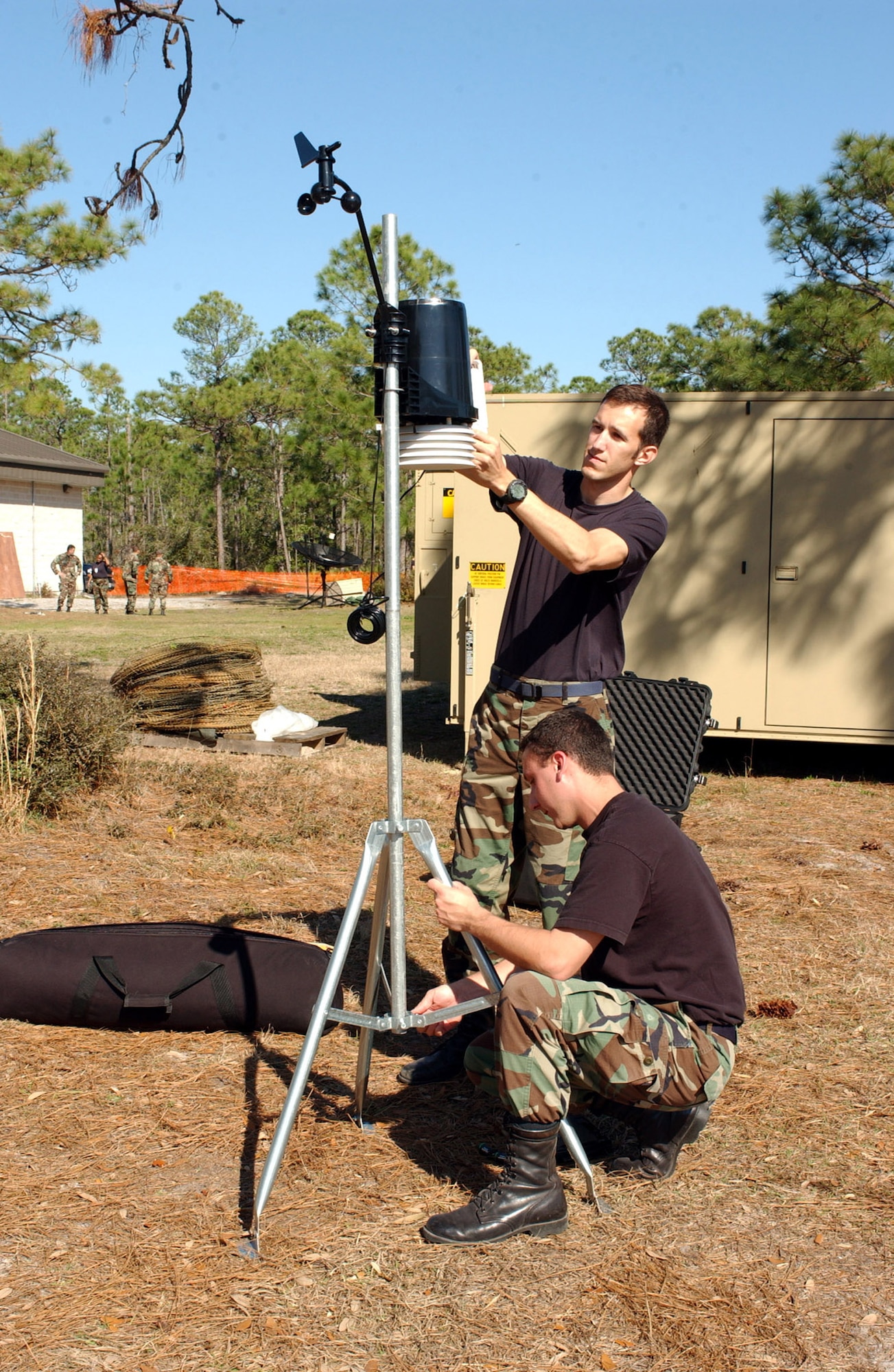 Staff Sgt. Ralph Nehring and Capt. Steve Maile, 16th Operations Support Squadron, set up the Davis Tactical Weather Obeserving Station at an exercise Wednesday. The exercise is in preparation for the upcoming Operational Readiness Inspection.