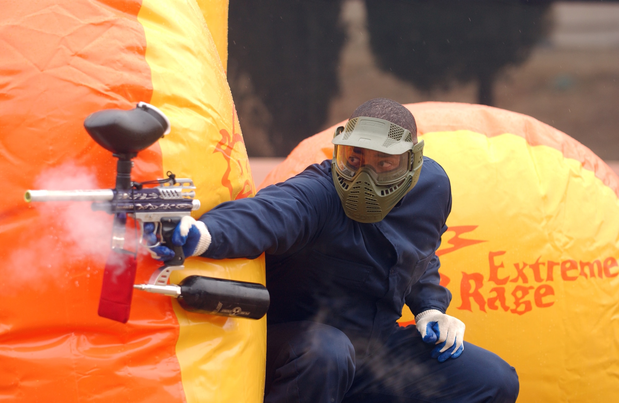 Capt. Jerime Reid fires at the "enemy" during the grand opening of the paintball course at Osan Air Base, South Korea, Tuesday, Feb. 28, 2006. Captain Reid is assigned to the 51st Services Squadron. (U.S. Air Force photo/Airman Gina Chiaverotti)


