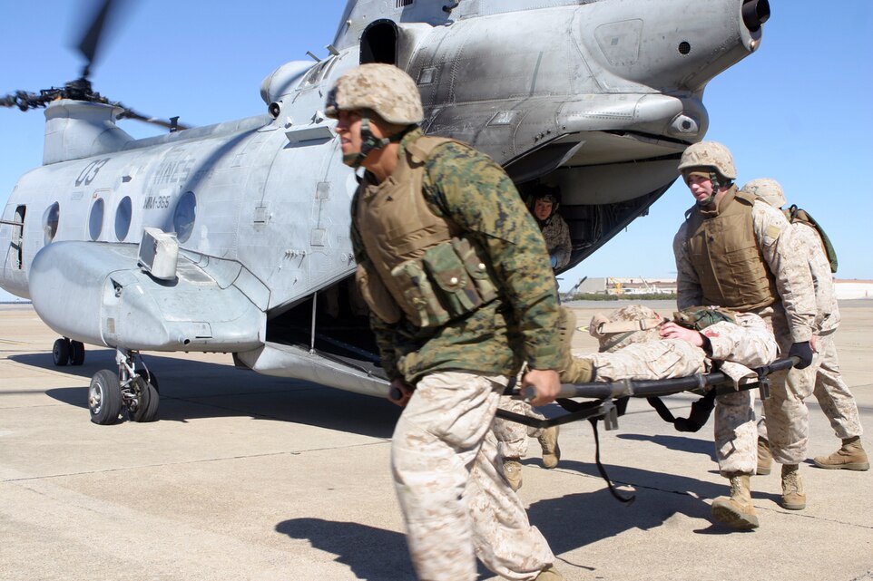 Marines with the 24th Marine Expeditionary Unit take a simulated casualty off of a CH-46E Sea Knight during a casualty evacuation mission March 4. The CASEVAC was part of the MEU?s Training in an Urban Environment exercise, being held in the Norfolk, Va., area through March 12.