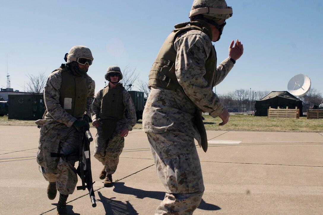 Marines with the 24th Marine Expeditionary Unit rush to unload a simulated casualty from a CH-46E Sea Knight during a casualty evacuation mission March 4.  The CASEVAC was part of the MEU?s Training in an Urban Environment exercise, being held in the Norfolk, Va., area through March 12.