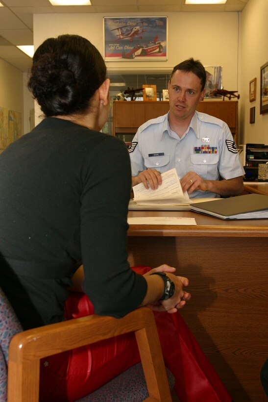 Tech. Sgt. Shawn Moore visits with Leslie Garrison about her upcoming trip to Basic Military Training. Sergeant Moore is one of seven recruiters assigned to the 419th Fighter Wing Recruiting Service. 