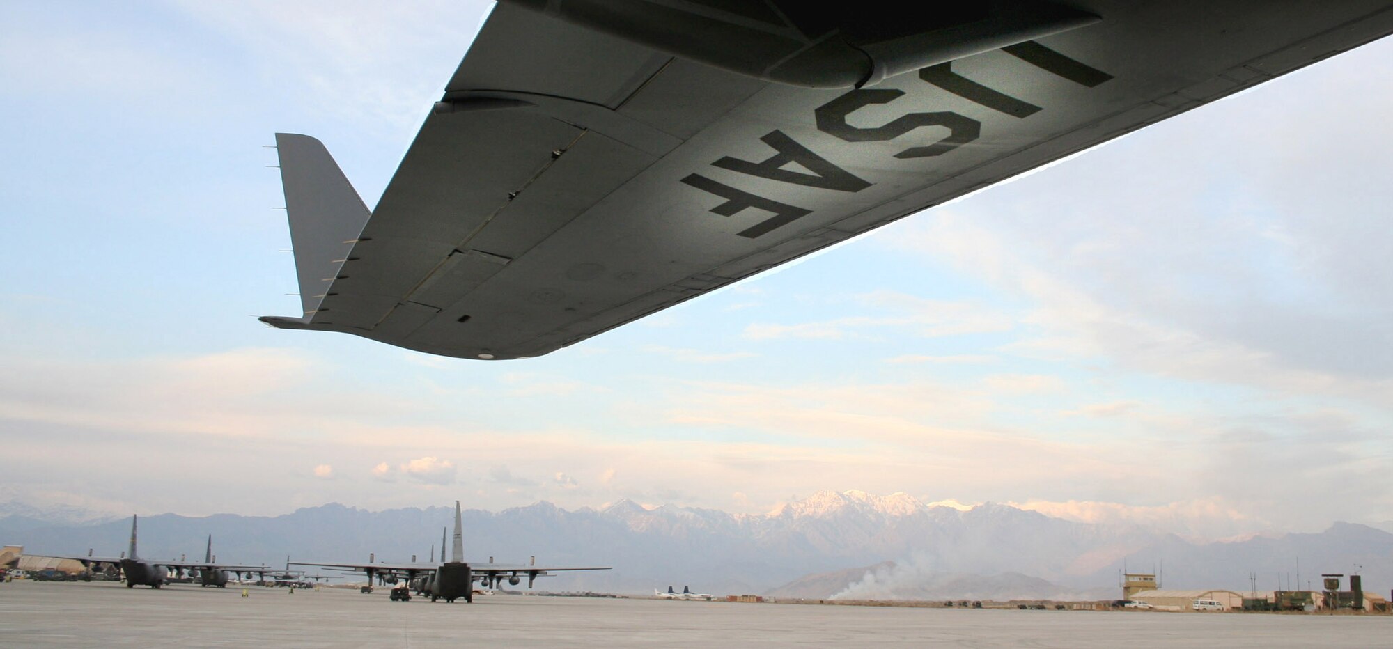 A fleet of C-17 Globemaster IIIs wait on the runway at Bagram Air Base, Afghanistan, to shuttle supplies and troops where they're needed in the region. (U.S. Air Force photo)