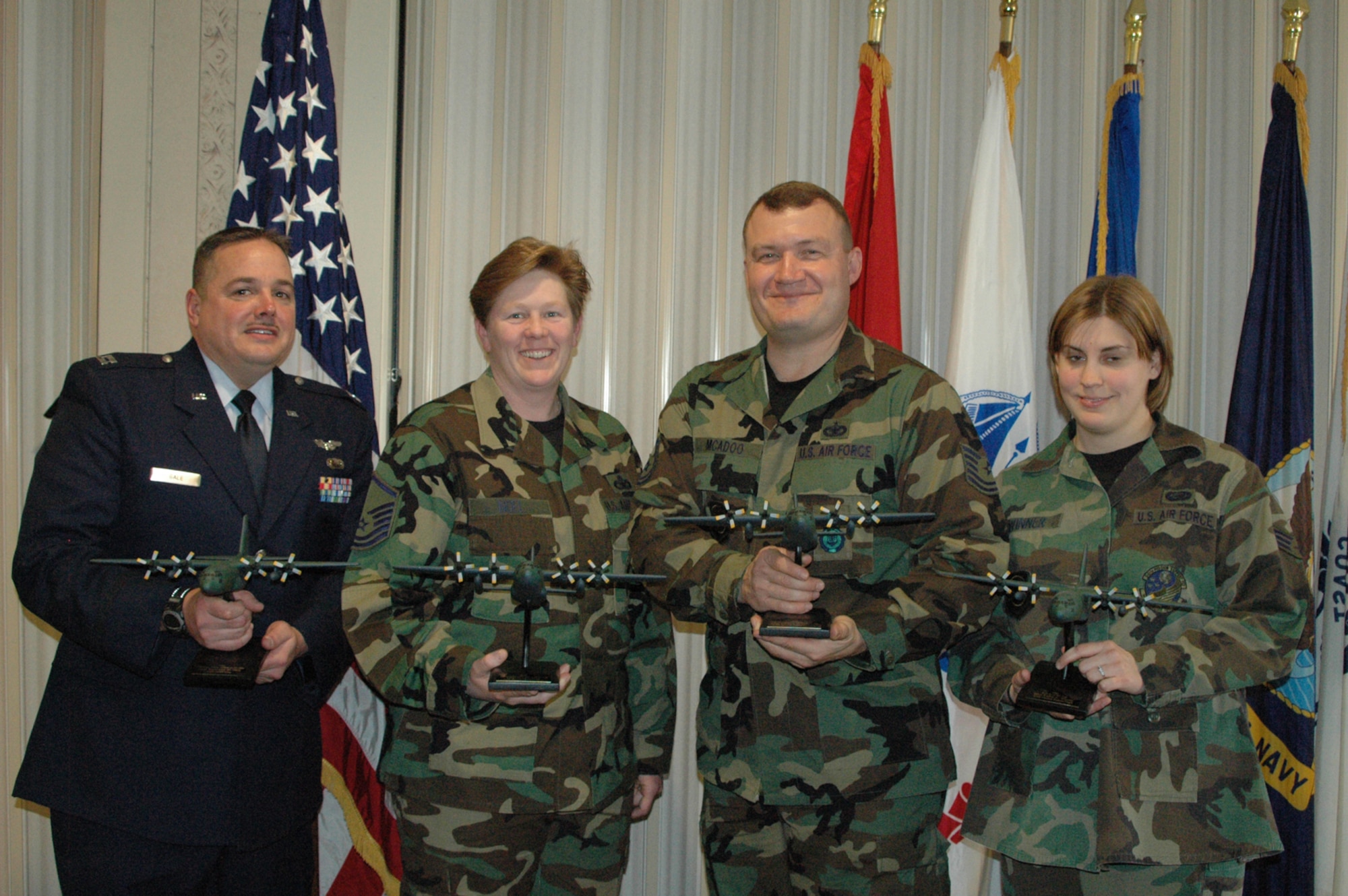 The Air Force Reserve's 910th Airlift Wing held its annual awards recognition luncheon March 4 at Youngstown Air Reserve Station.  The following Air Force Reserve Airmen were honored during the event for being chosen 2005 "Of the Year" recipients.  Capt. Ray Gale, Company Grade Officer; MSgt. Renee Noel, Senior NCO; TSgt. William McAdoo, NCO; and SrA. Kathy Winner, Airman of the Year.  (U.S. Air Force photo by Air Force Reserve Airman 1st Class Ann W. Jefferson.)