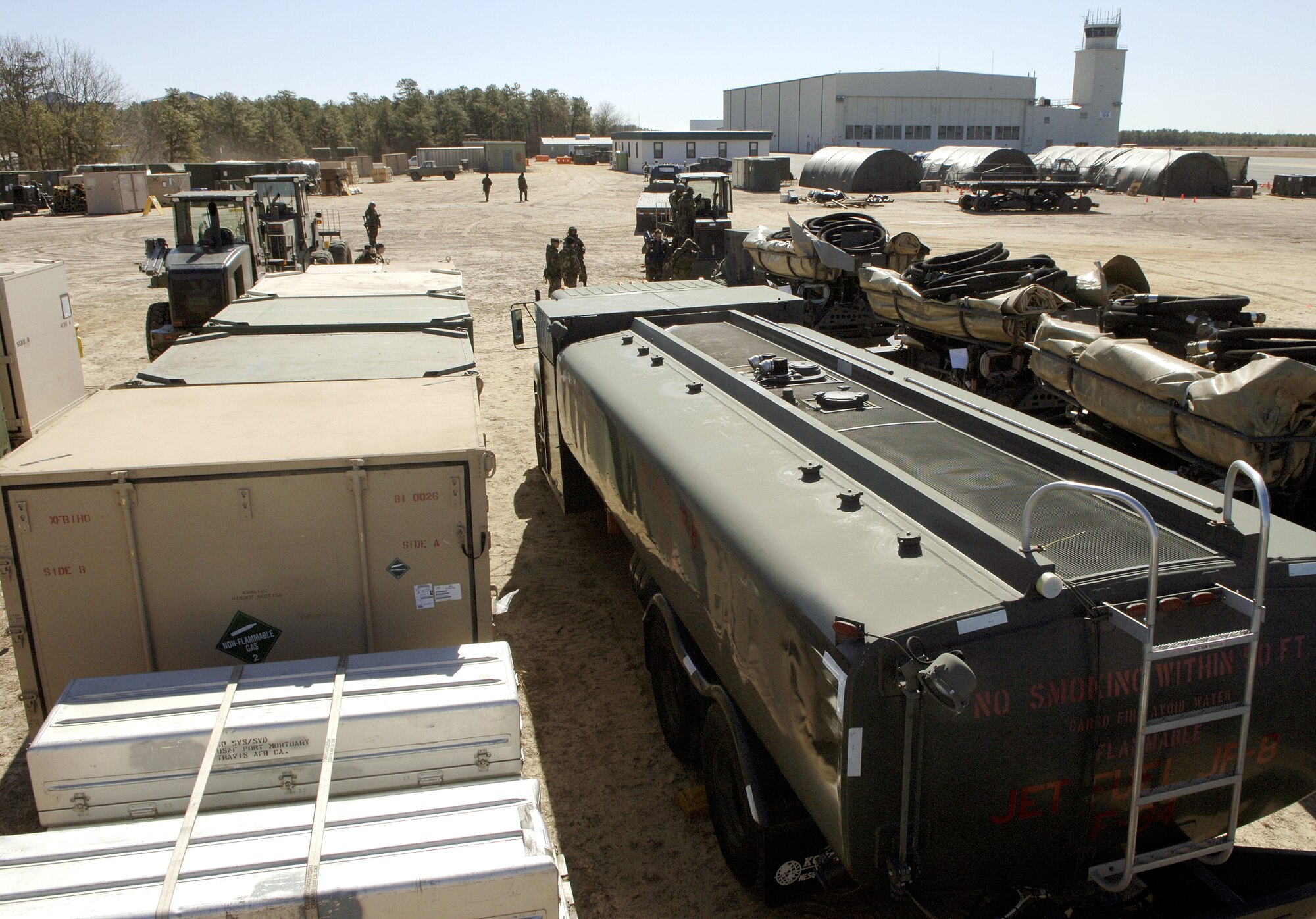 Cargo is prepared for distribution during Exercise Eagle Flag's humanitarian relief operations Sunday, March 5, 2006 at Naval Air Engineering Station Lakehurst, N.J.  Eagle Flag is designed to simulate real-world conditions as closely as possible. By the time the exercise ends March 10, Airmen will have processed and distributed more than 100,000 pounds of humanitarian aid. This is the first time the exercise has had a humanitarian relief operations scenario. (U.S. Air Force photo/Master Sgt. Jack Braden)