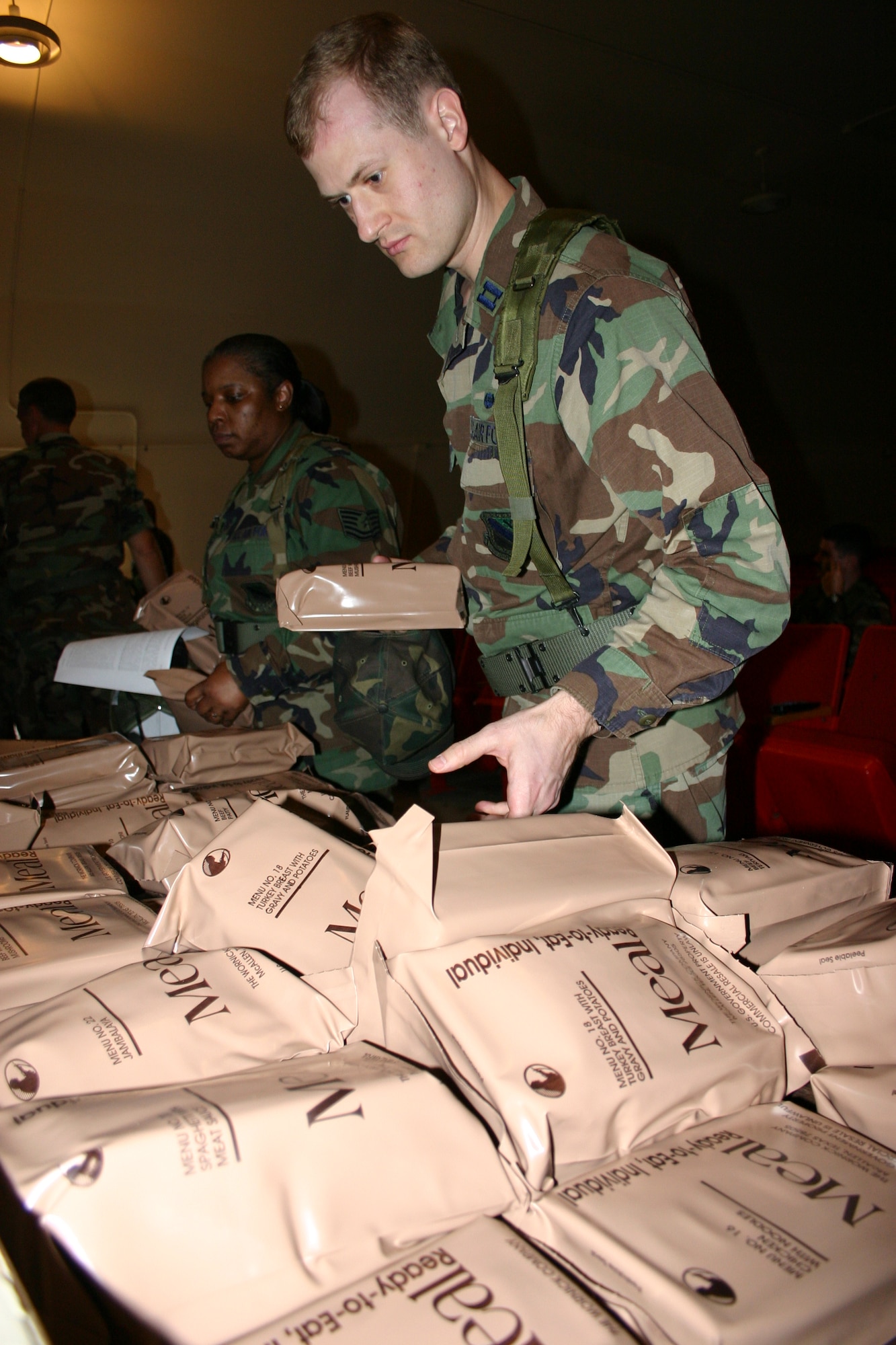 HAWAII -- Capt. Matthew Hill, 3 WG/JA, Elmendorf AFB, Alaska, selects meals ready-to-eat to get him through the five-day Pacific Joint Legal Exercise. Capt. Hill is one of nearly 30 legal professionals participating in PACJOLE at the Pohakuloa Training Area on the island of Hawaii this week.