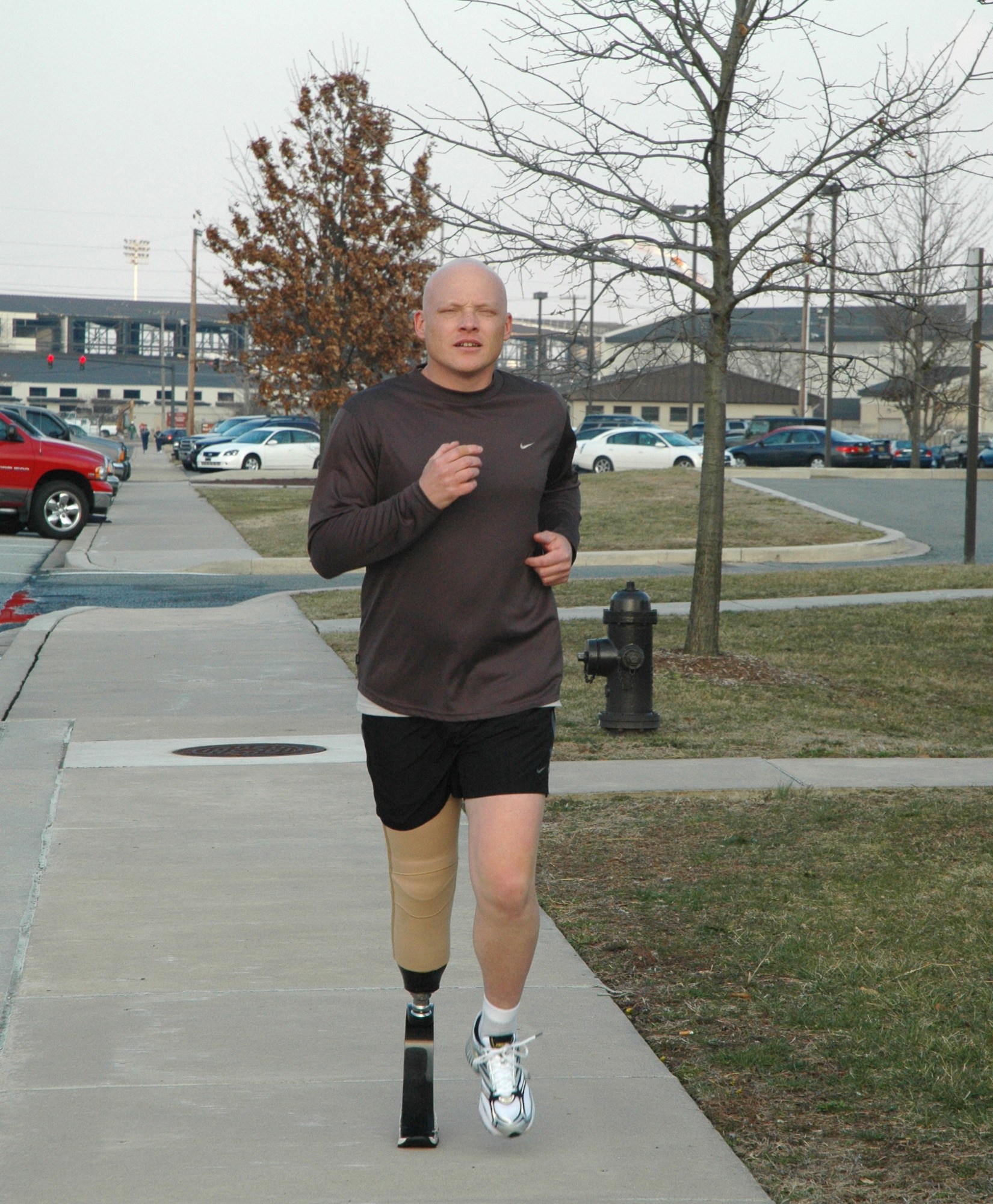 Tech. Sgt. Matthew Profitt runs wearing a flexible prosthesis, a C-Sprint, which absorbs impact. In 2003, while activated at Dover Air Force Base, Del., supporting the war on terrorism, the reservist's leg was amputated when he was diagnosed with epithelioid sarcoma, a malignant soft tissue tumor. He is a 512th Aircraft Maintenance Squadron guidance and control section technician. (U.S. Air Force photo/1st Lt. Marnee A.C. Losurdo)