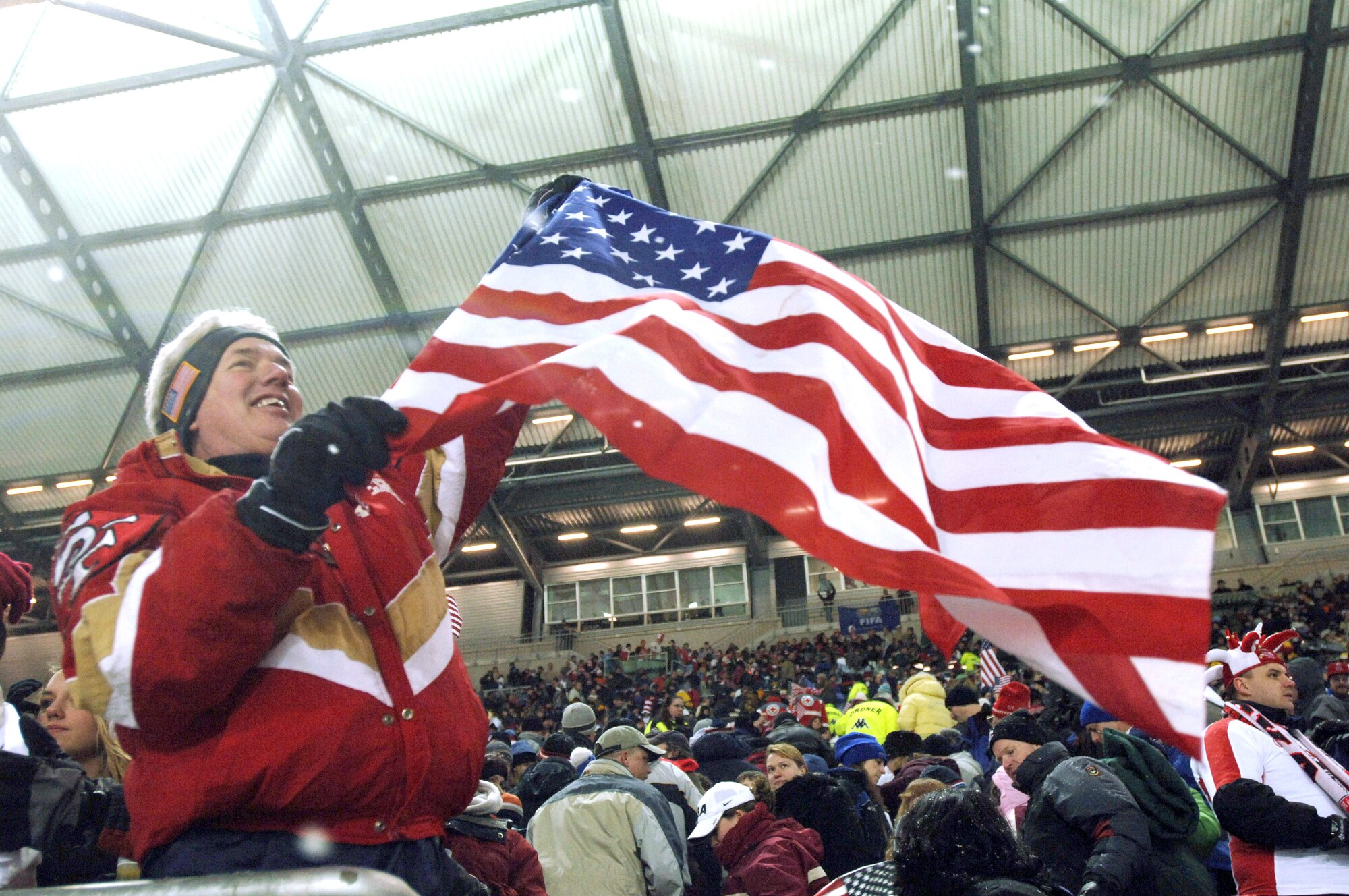 A U.S. flag is waved after the U.S. Men's National Soccer Team squeezes out a 1-0 victory over Poland.  More than 13,000 soccer fans attended the exhibition match at Fritz-Walter-Stadium. The American team will play the German National Team Wednesday, March 22, 2006, at Dortmund, Germany. (U.S. Air Force photo/Master Sgt. John E. Lasky)