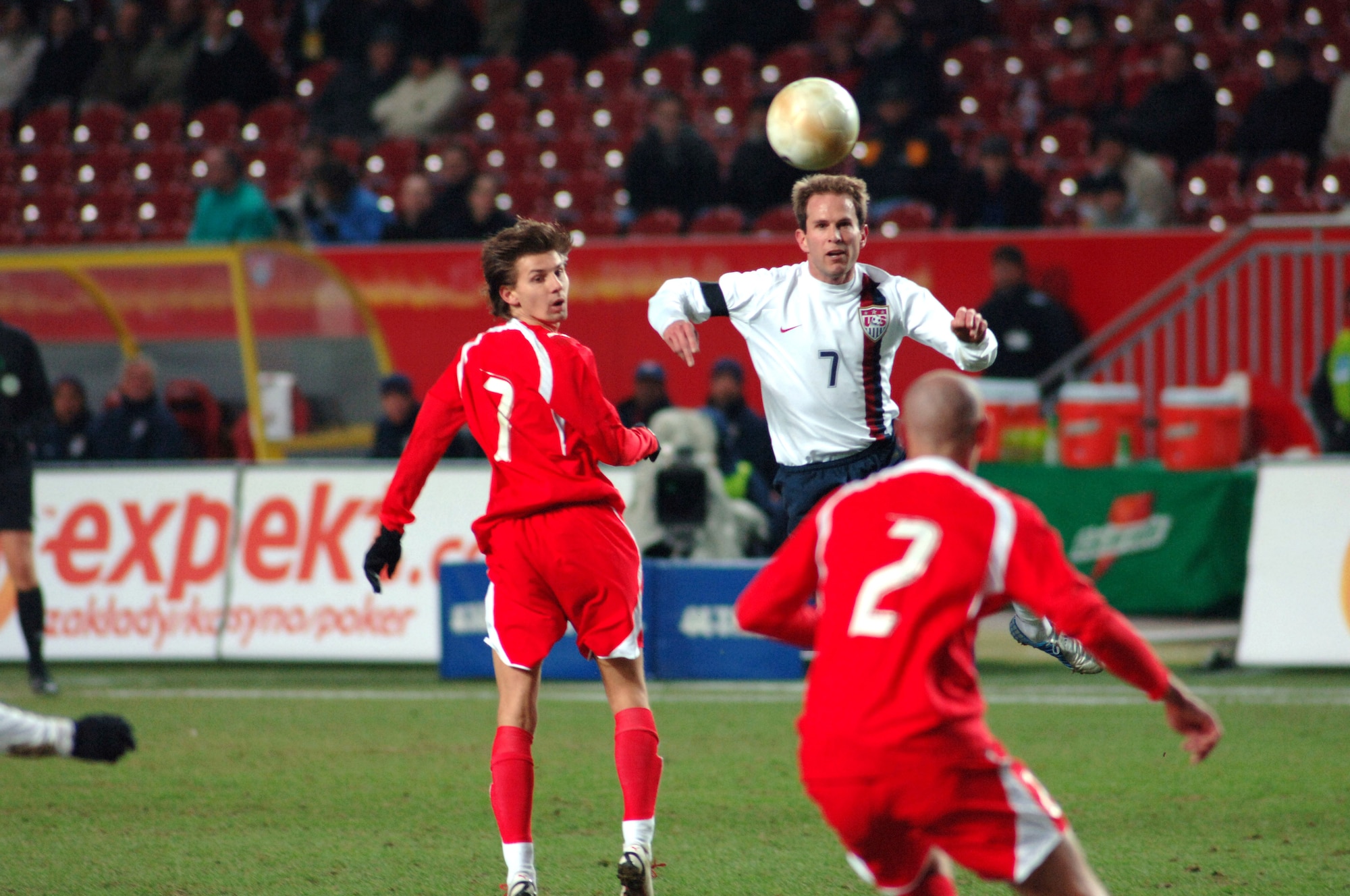 American soccer player Eddie Lewis directs the ball forward with a "header" during the U.S. Men's National Soccer Team 1-0 victory over Poland, Wednesday, March 1, 2006, in Kaiserslautern, Germany.  More than 13,000 soccer fans attended the exhibition match at Fritz-Walter-Stadium. (U.S. Air Force photo/Master Sgt. John E. Lasky)