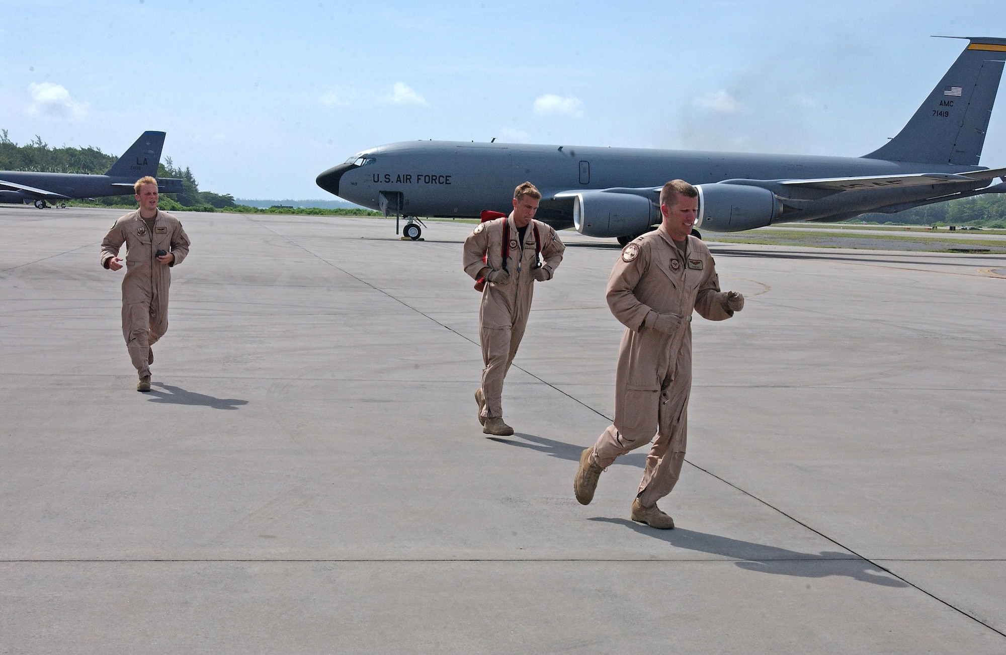 A KC-135 Stratotanker aircrew scrambles from their jet following an in-flight emergency. The KC-135s refuel B-52 Stratofortresses that provide close air support for troops on the ground in Afghanistan. (U.S. Air Force photo/Staff Sgt. Doug Nicodemus)

