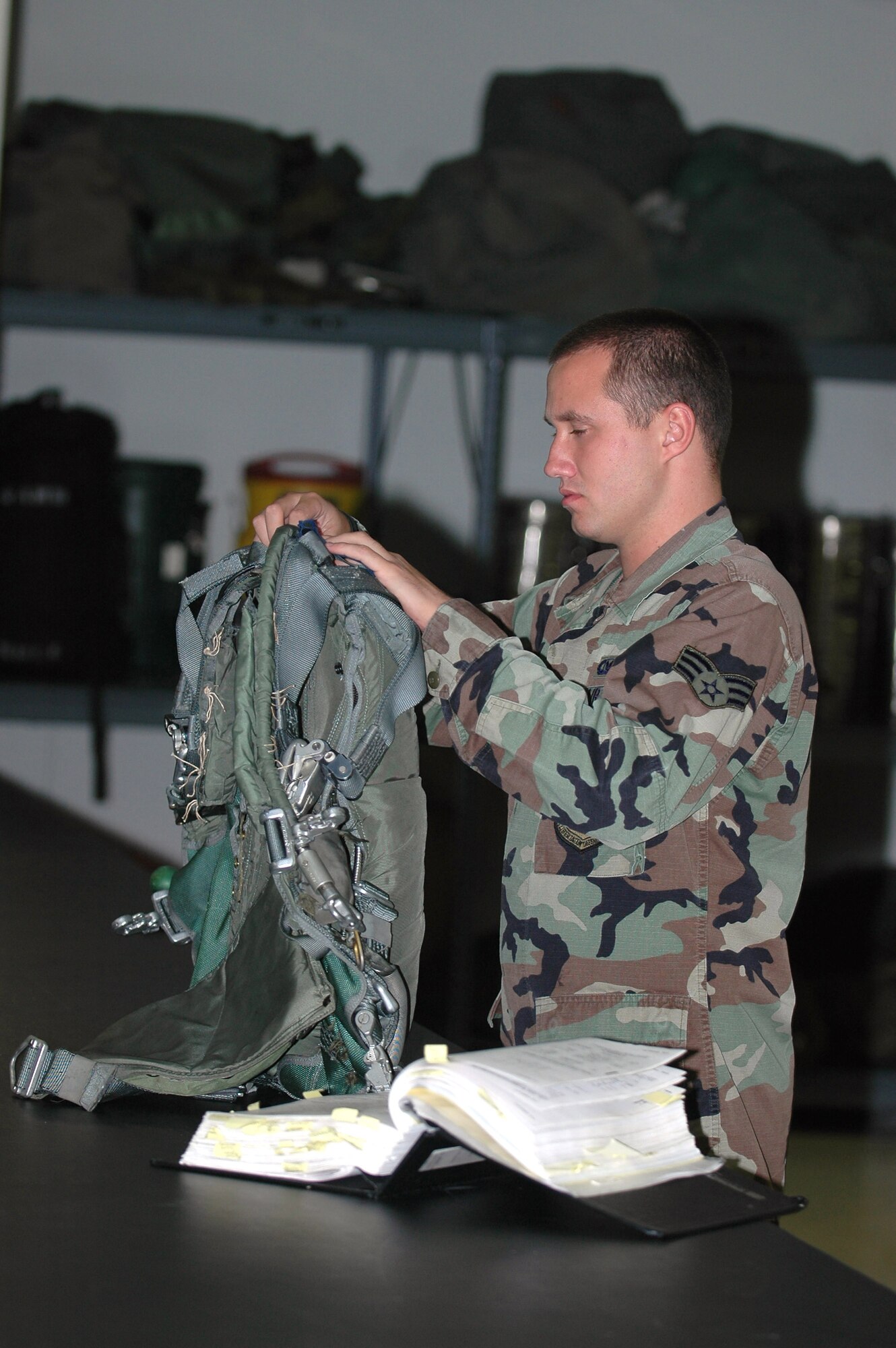 Senior Airman Joshua Beers inspects a parachute for a KC-135 Stratotanker. This item is inspected every 30 days. Airman Beers is a life support technician with the 20th Expeditionary Bomb Squadron at a forward deployed location supporting Operation Enduring Freedom. He is deployed from Barksdale Air Force Base, La. (U.S. Air Force photo/Staff Sgt. Doug Nicodemus) 