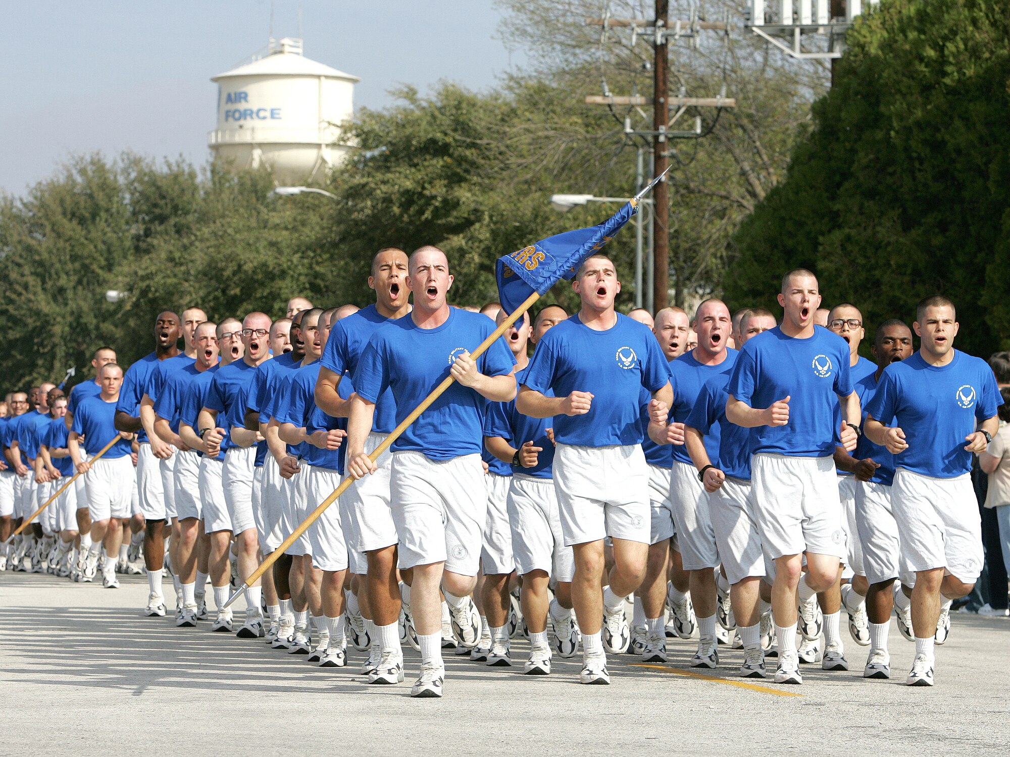 Airmen with the 331st Training Squadron's Flight 217 sing cadence Thursday, March 2, 2006, as complete their last physical fitness requirement, a 2.5-mile run, before graduating March 3 from basic military training at Lackland Air Force Base, Texas. (U.S. Air Force photo/Robbin Cresswell)