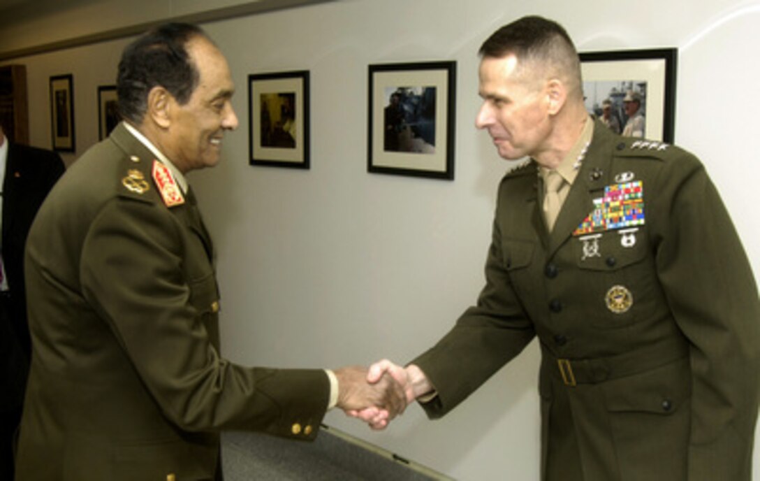 Chairman of the Joint Chiefs of Staff Gen. Peter Pace (right), U.S. Marine Corps, greets Egyptian Minister of Defense Field Marshal Mohamed Hussein Tantawi as he arrives for a working lunch with Secretary of Defense Donald H. Rumsfeld at the Pentagon in Arlington, Va., on March 7, 2006. Pace, Tantawi, Rumsfeld and their senior advisors are meeting to discuss security issues of mutual interest. 