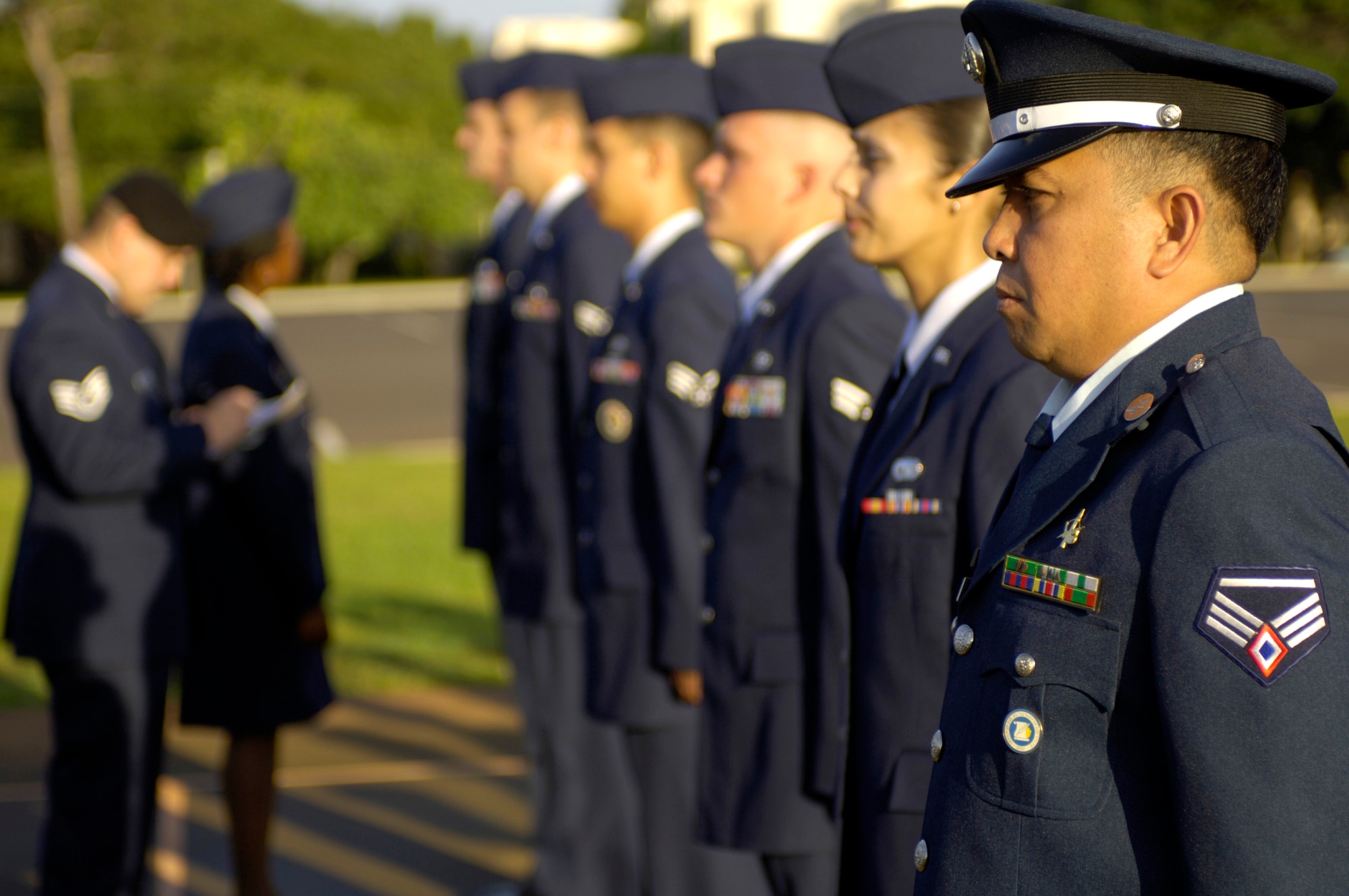 HICKAM AIR FORCE BASE, Hawaii -- Staff Sgt. Noel Alarcon from the Philippine Air Force stands at attention for an open ranks inspection during Airman Leadership School class Wednesday, March 8, 2006, at Hickam Air Force Base, Hawaii. Sergeant Alarcon and four other Philippine Air Force students are the first Airmen from their service to attend the class. They will take back the lessons learned and develop their own leadership course within their air force.