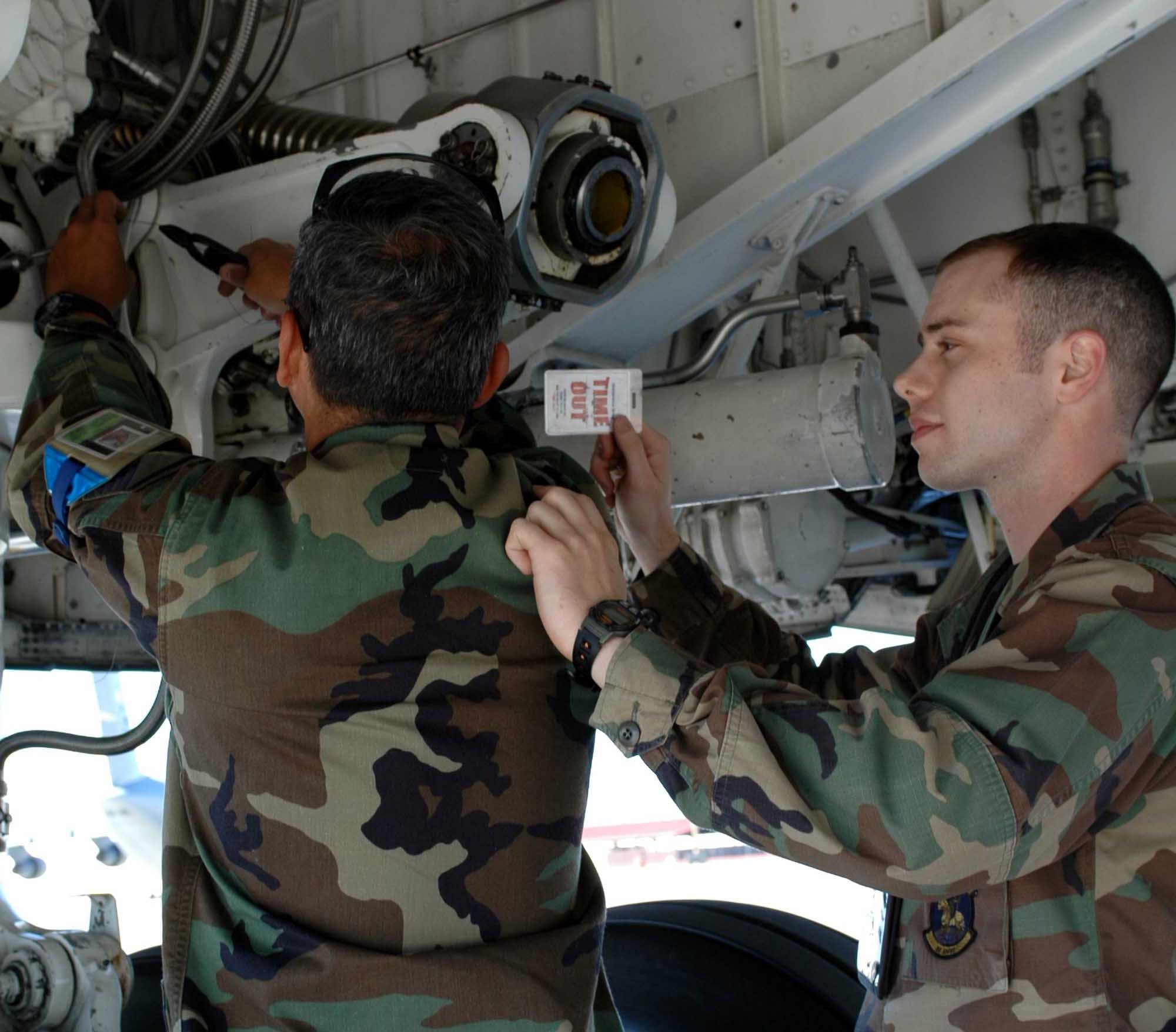 2nd Lt. Wesley Hayne, 60th Aircraft Maintenance Squadron assistant officer in charge, simulates calling “time out” for improper use of eye protection on flightline. (U.S. Air Force photo by Staff Sgt. Matt McGovern) 