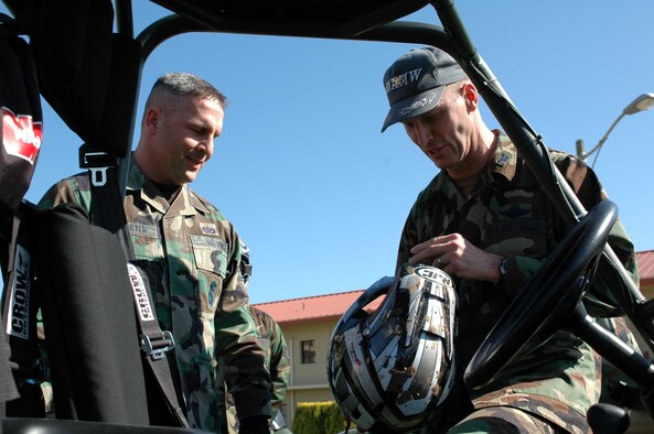 Col. Timothy Zadalis, 60th Air Mobility Wing acting commander, takes the safety of Travis Airmen personally as he checks the helmet of Staff Sgt. Jon Baumeyer, 60th Security Forces police services NCOIC.  (U.S. Air Force photo by Staff Sgt. Matt McGovern)