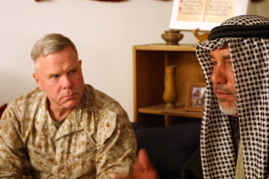 Sheik Abdulamir al-Jaber speaks with Lt. Gen. James F. Amos, II Marine Expeditionary Force commanding general during a cultural immersion dinner March 10. Al-Jaber said he had traveled from southern Iraq just 20 days ago to help train the Marines in Iraqi culture during the 24th Marine Expeditionary Unit's Training in an Urban Environment Exercise
