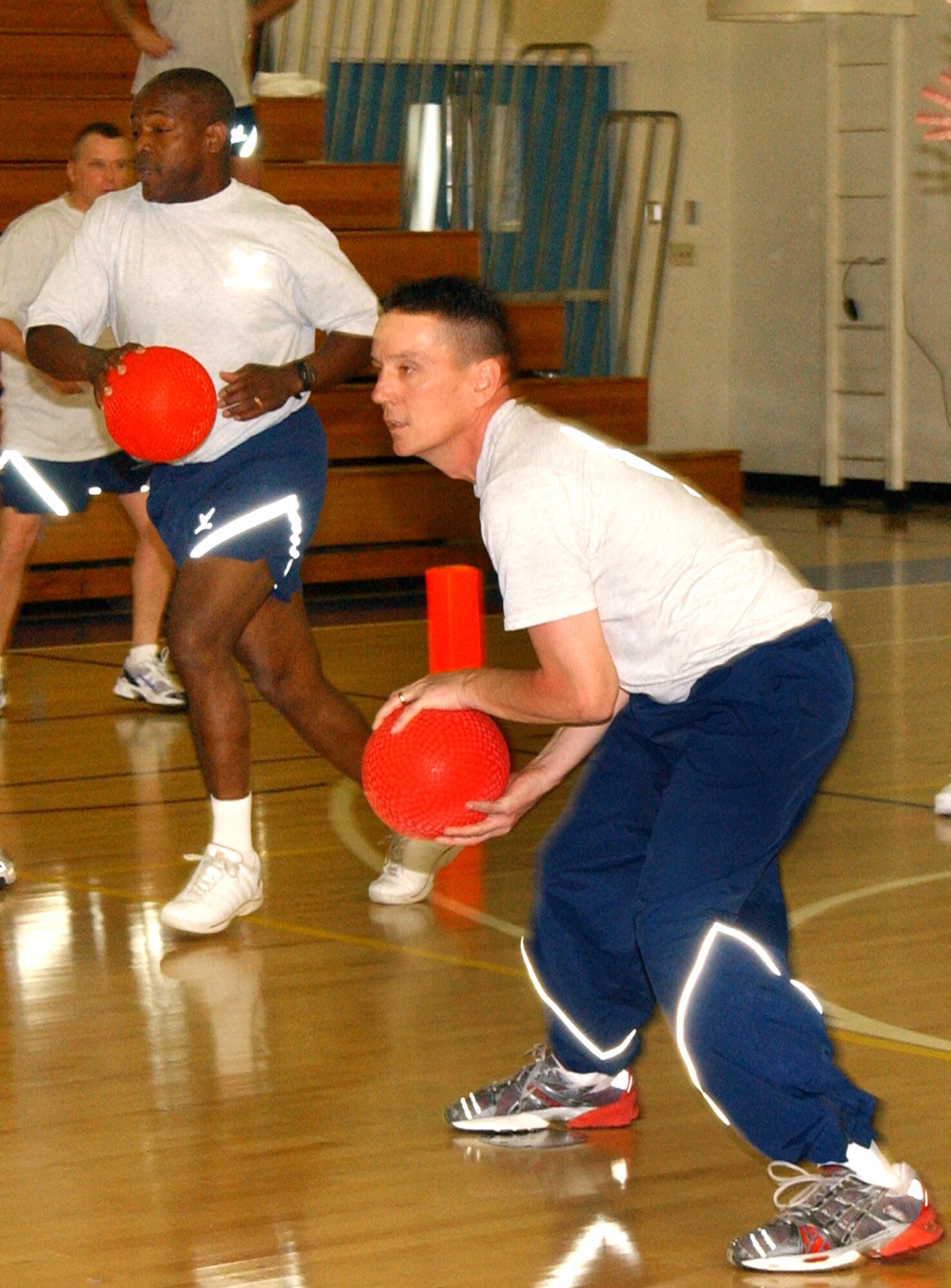 Chief Brye McMillon [left] targets an opponent on the Eagles team while Chief Timothy Pritchett prepares to deflect a ball. (U.S. Air Force photo by Nan Wylie)