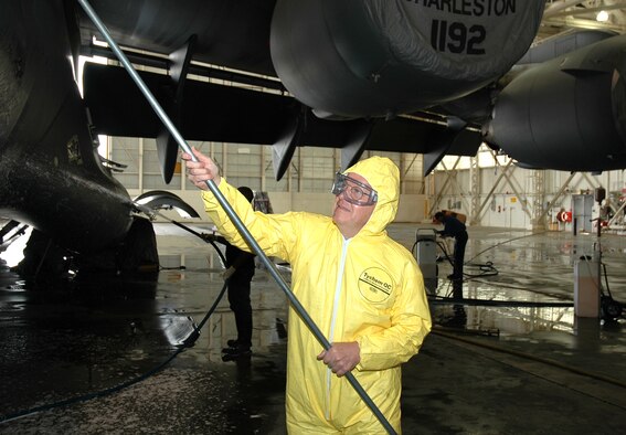 Col. James Joyce, 315th Maintenance Group commander, Charleston AFB, S.C., scrubs a C-17 Globemaster III to raise money for the 2006 315/437th Maintenance Group dining out.  The colonel helped raise more than $1,000 by washing the jet. (Photo by Tony Clark, USAFR)