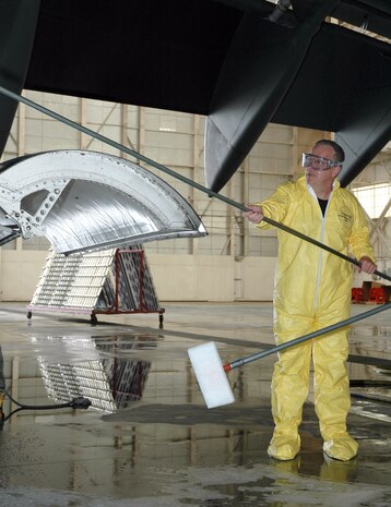 Col. James Joyce, 315th Maintenance Group commander, Charleston AFB, S.C., scrubs a C-17 Globemaster III to raise money for the 2006 315/437th Maintenance Group dining out.  The colonel helped raise more than $1,000 by washing the jet.  (Photo by Tony Clark, USAFR)