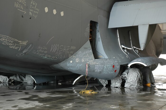 A dirty C-17 Globemaster III at Charleston AFB, S.C. gets ready to be washed as part of a fund raiser to support the 2006 315/437th Maintenance Group dining out.  The drive raised $1,070 to support the function.  (Photo by Tony Clark, USAFR)