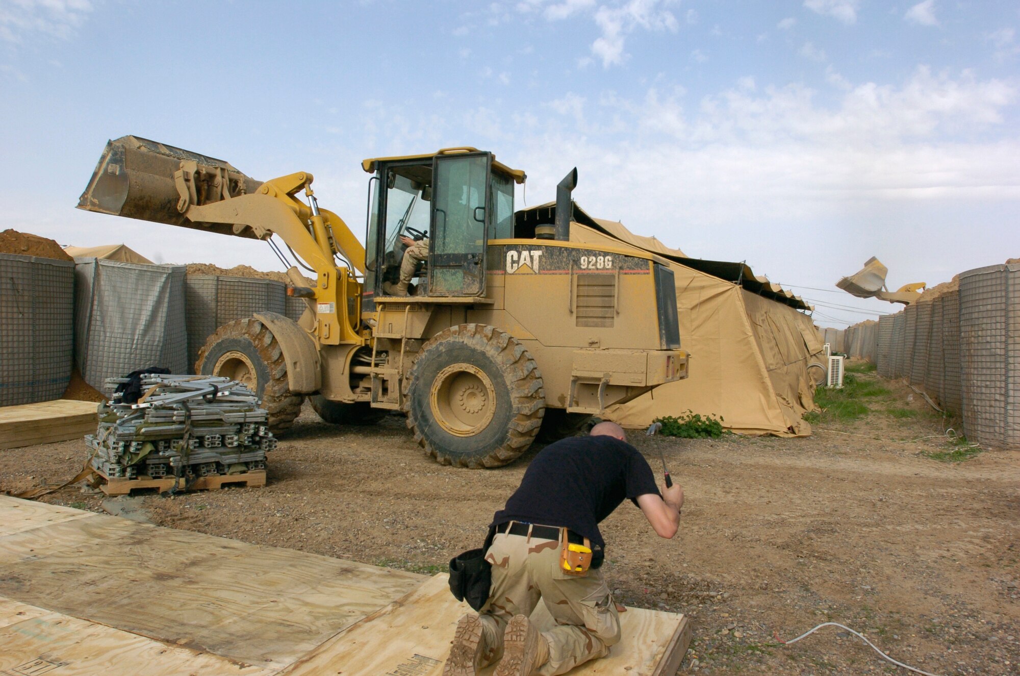 Air Force engineers from the 557th Expeditionary Red Horse Squadron work to improve the quality of living for Soldiers from 1st Battalion, 327th Infantry Regiment, 101st Airborne Division, stationed on Forward Operating Base McHenry, Iraq. (U.S. Army photo/Spc. Barbara Ospina)