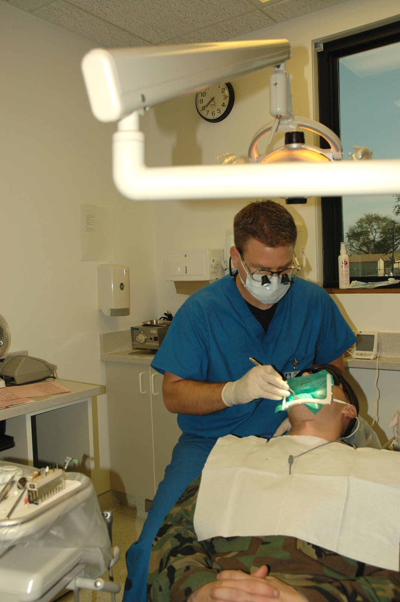 Capt. (Dr.) Benjamin Clark performs a patient a root canal Monday, March 6, 2006. The advanced education in general dentistry resident program at Barksdale Air Force Base, La., is the only Air Force dentistry program that accepts dentists who have already served in the military for a few years. Doctor Clark is assigned to the 2nd Dental Squadron. (U.S. Air Force photo/Staff Sgt. Jeremy Larlee)