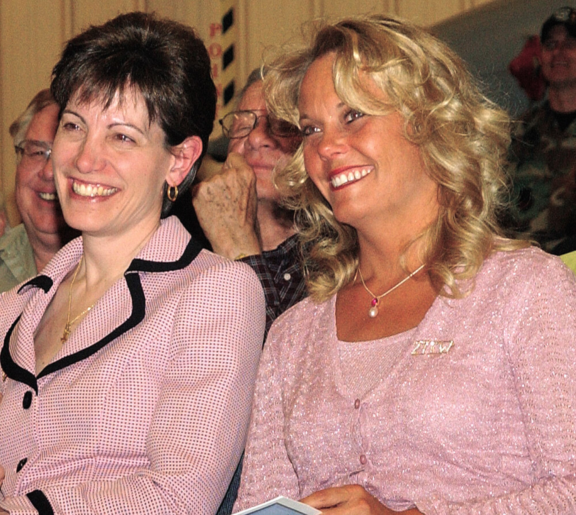 CANNON AIR FORCE BASE, N.M. -- Geri Posner (left), wife of former 27th FW commander Col. John Posner, watches her husband relinquish command of the 27th FW to Jane West’s (right) husband, Colonel West.