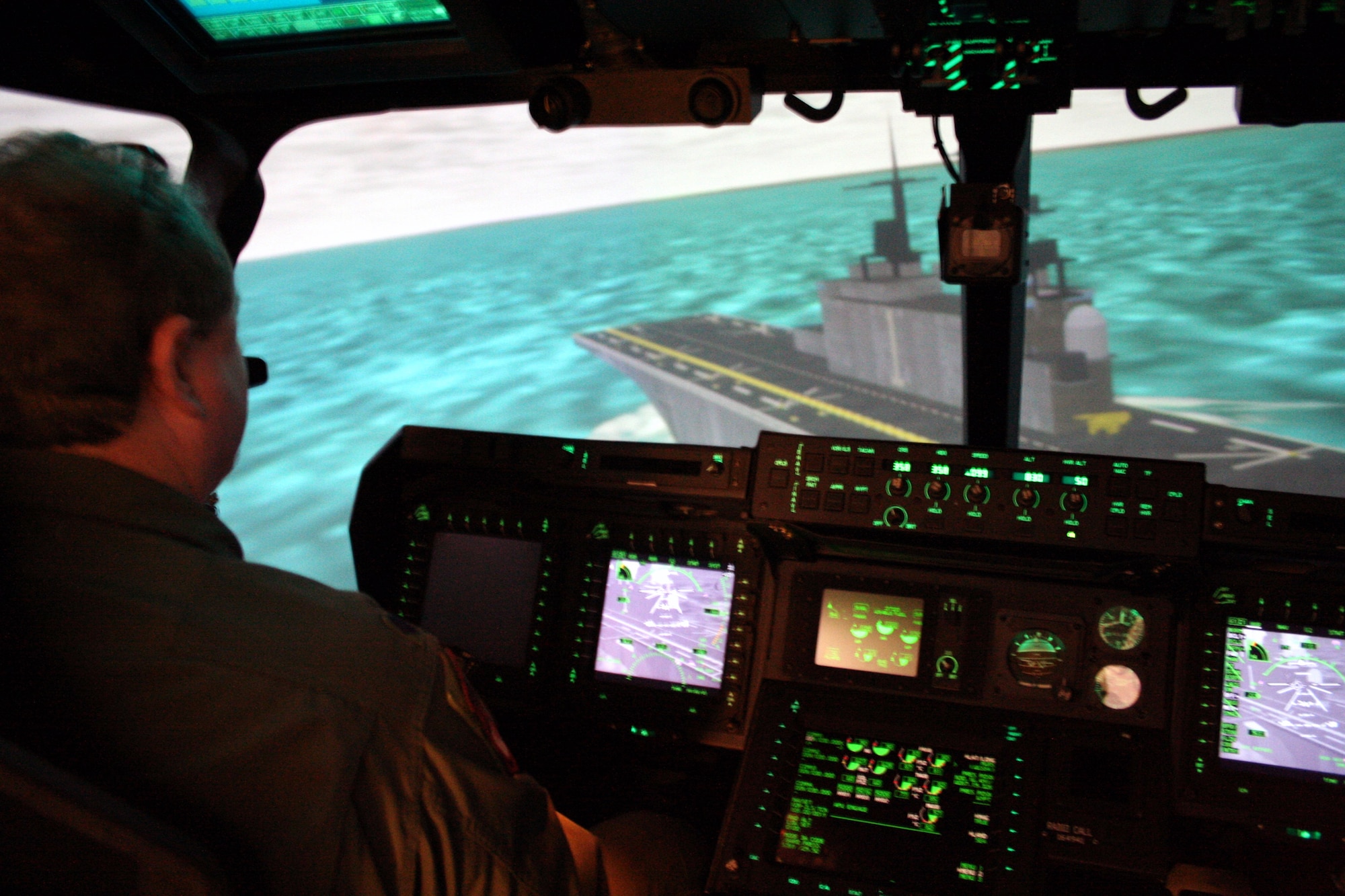 Lt.Col. Jonathan Jay, CV-22 program manager, lines up for landing on an aircraft carrier in the CV-22 simulator.