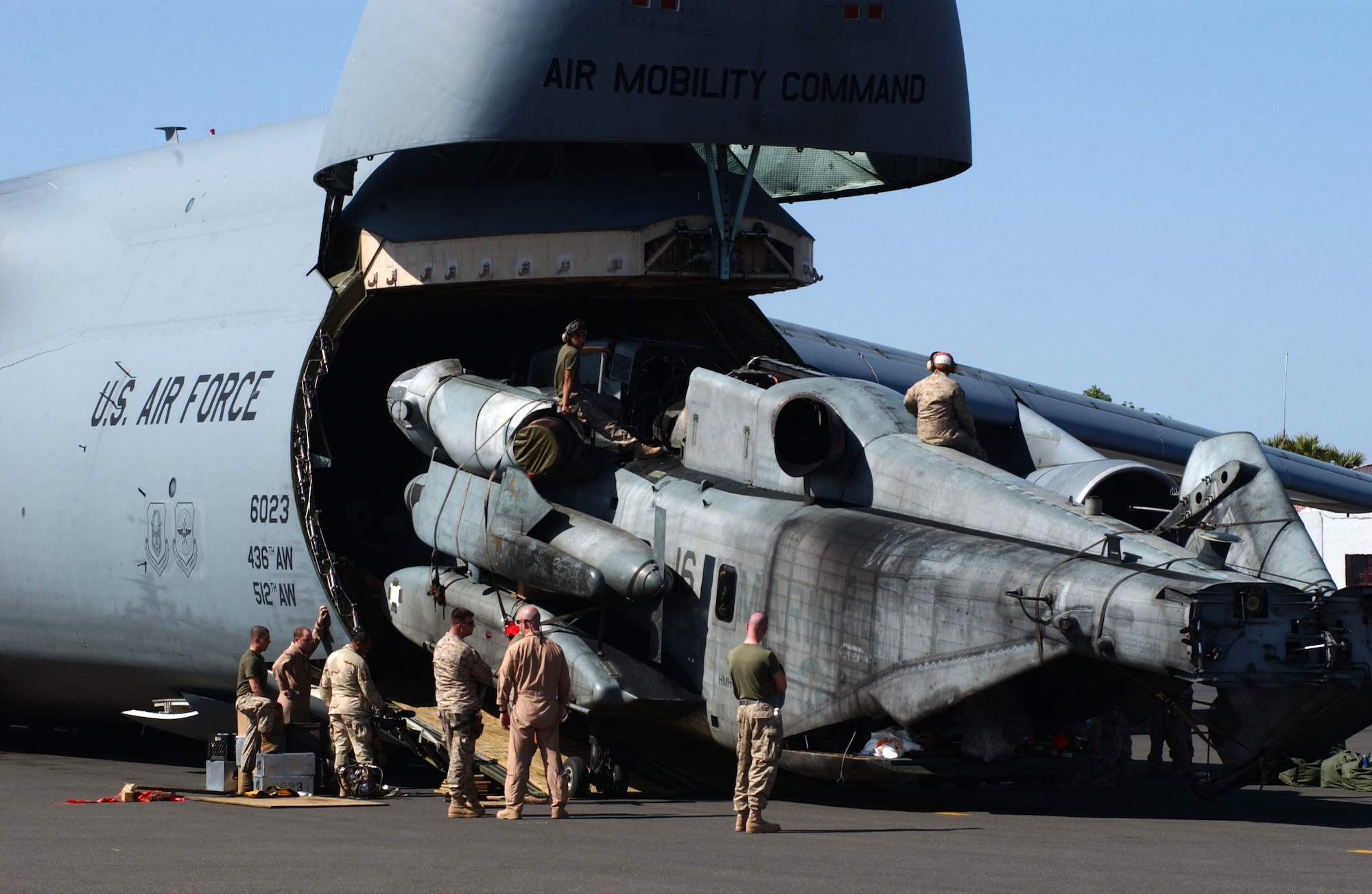 A U.S. Marine Corps CH-53E Super Stallion is offloaded from an Air Force C-5 Galaxy at the Djibouti Airport in Djibouti, Africa, Friday, March 3, 2006. (U.S. Air Force photo/Staff Sgt. Nic Raven)