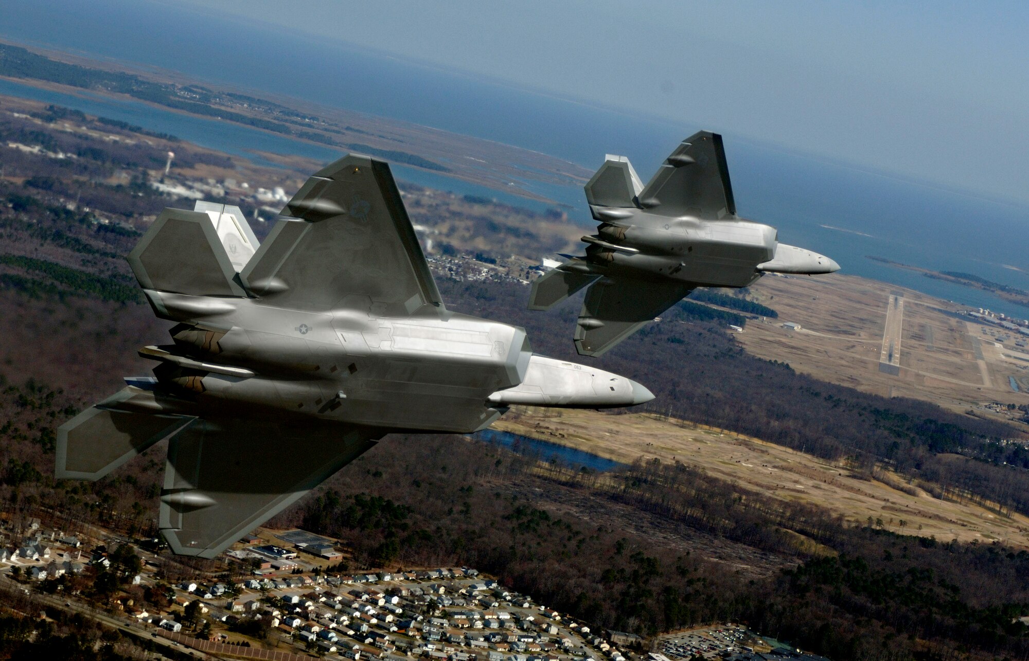Lt. Col. Dirk Smith, 94th Fighter Squadron commander, and Maj. Kevin Dolata, 94th FS assistant director of operations, turn in on final approach to Langley Air Force Base, Va., Friday, March 3, 2006, to deliver the first F-22A Raptors assigned to the 94th Fighter Squadron.  (U.S. Air Force photo/Tech. Sgt. Ben Bloker)
