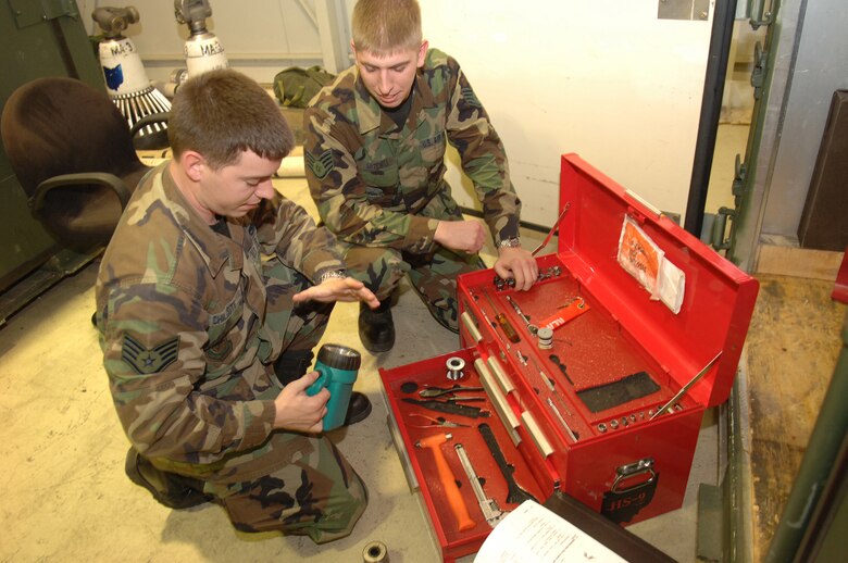 INCIRLIK AIR BASE, Turkey (USAFENS) -- (Left to right) SSgt. Matt Chilcote and SSgt. Adam Mitchell inventory the tools they routinely use to perform their maintenance duties. Both are part of the 121 EARS deployed here from Rickenbacker ANGB near Columbus, Ohio.