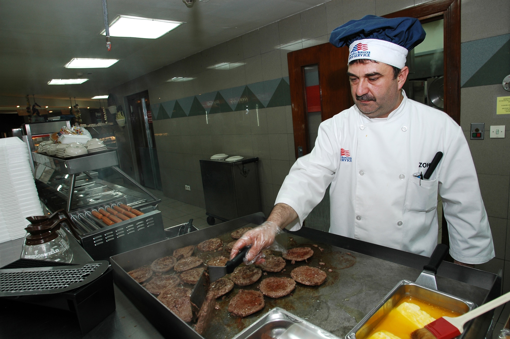 INCIRLIK AIR BASE, Turkey (USAFENS) -- A Vinnell Brown and Root employee prepares dinner at the Sultan's Inn Dining Facility. VBR employees can be found in the 39th Services Squadron, 39th Civil Engineer Squadron and the 39th Logistics Readiness Squadron. (Photo by Master Sgt. William Gomez.)