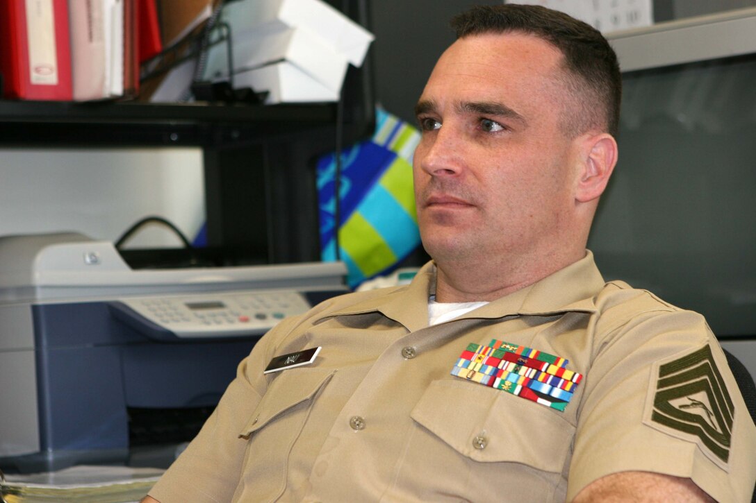 060310-M-3677-001 MARINE CORPS BASE CAMP PENDLETON, Calif. -- Col. Robert J. Coates passes on the reconnaissance paddle to Lt. Gen. John F. Goodman at the deactivation ceremony of Marine Corps Special Operations Capable Detachment One. The three-year-old experimental unit was similair to the Marine Raiders of World War II, some of whom were present at the deactivation ceremony March 10. Coates is the commanding officer of Detachment One and Goodman is the Commanding General of Fleet Marine Force Pacific. (Official U.S. Marine Corps photo by Lance Cpl. Sara Cantrell)(released)