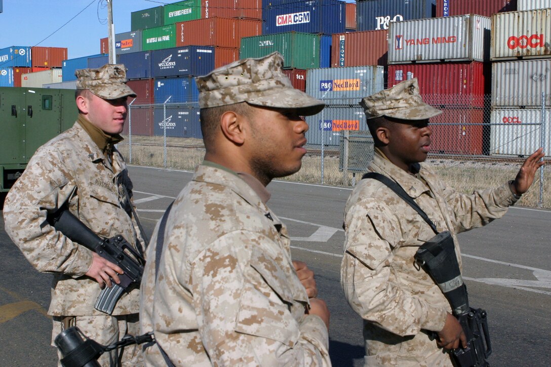 Marines with Alpha Company 1st Battalion, 8th Marine Regiment, Battalion Landing Team 24th Marine Expeditionary Unit provide security at a port facility March 11. The training was part of the 24th MEU's Training in an Urban Environment Exercise taking place in Hampton Roads, Va.