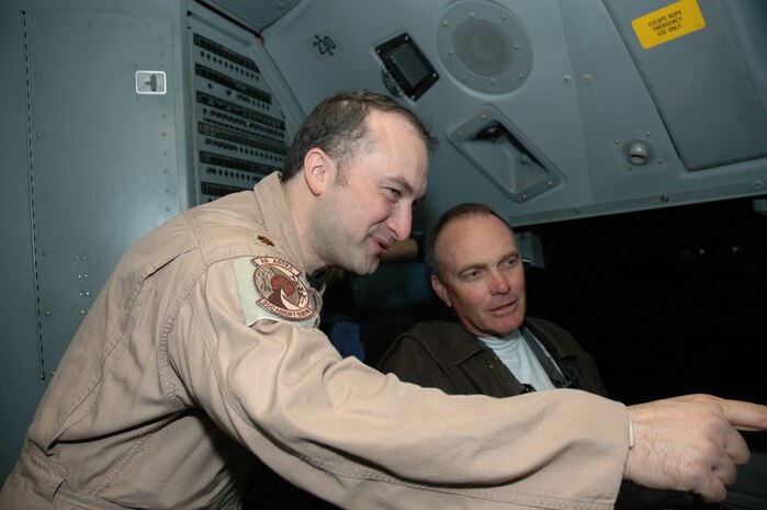 Maj. Dave Harden a reservist assigned to the 300th Airlift Squadron, Charleston AFB, S.C. talks to WCBD-TV (News Channel 2) Anchor, Warren Peper talks about the C-17 Globemaster III as they prepare to leave for Germany and Iraq.  WCBD accompanied the 315th Airlift Wing on a trip to feature deployed members of the wing.  (Photo by 1st Lt Wayne Capps, USAFR)