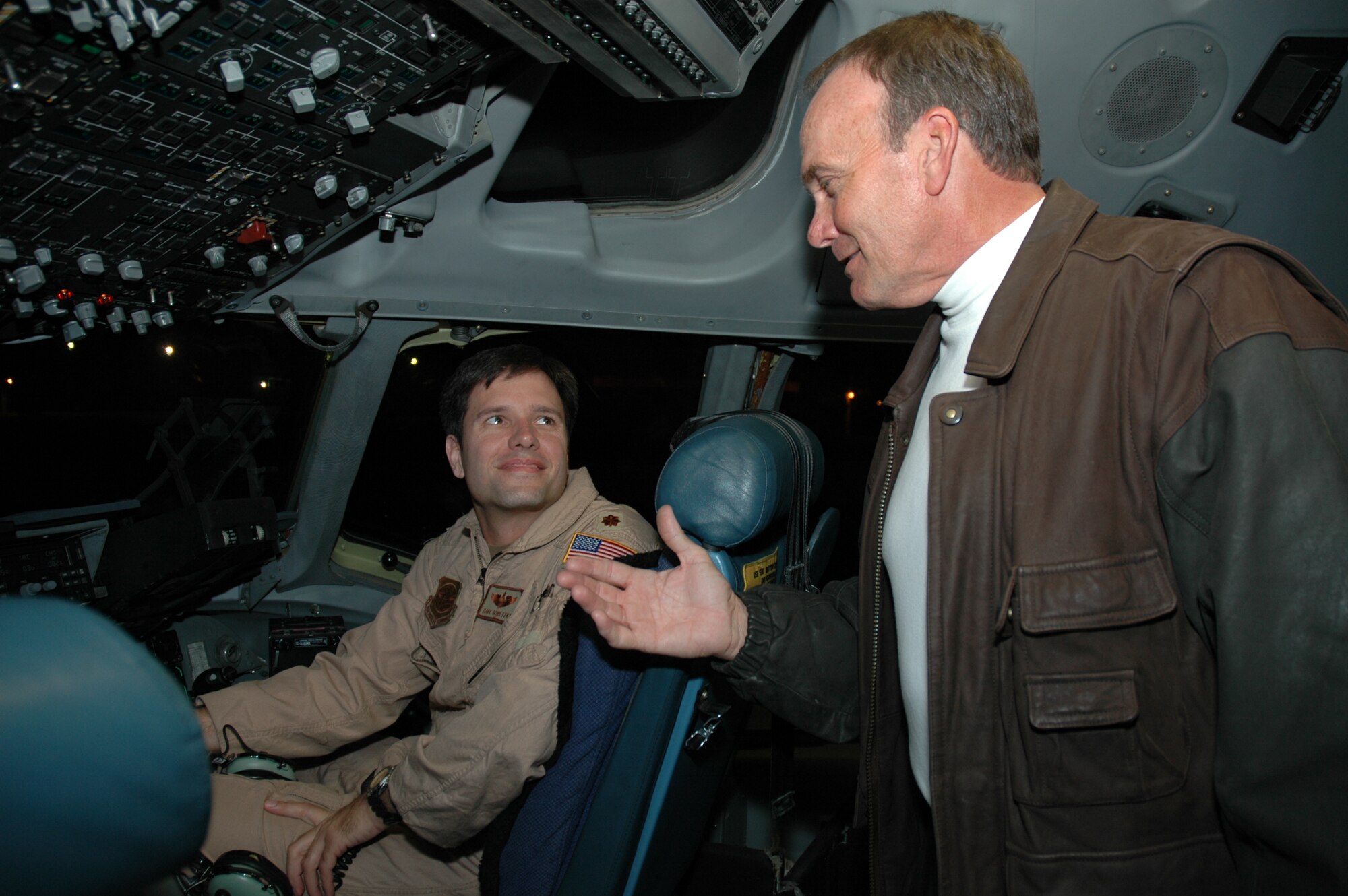 WCBD-TV (News Channel 2) Anchor, Warren Peper talks to an aircrew member assigned to the 300th Airlift Squadron, Charleston AFB, S.C. as they prepare to leave for Germany and Iraq.  WCBD accompanied the 315th Airlift Wing on a trip to feature deployed members of the wing.  (Photo by 1st Lt Wayne Capps)