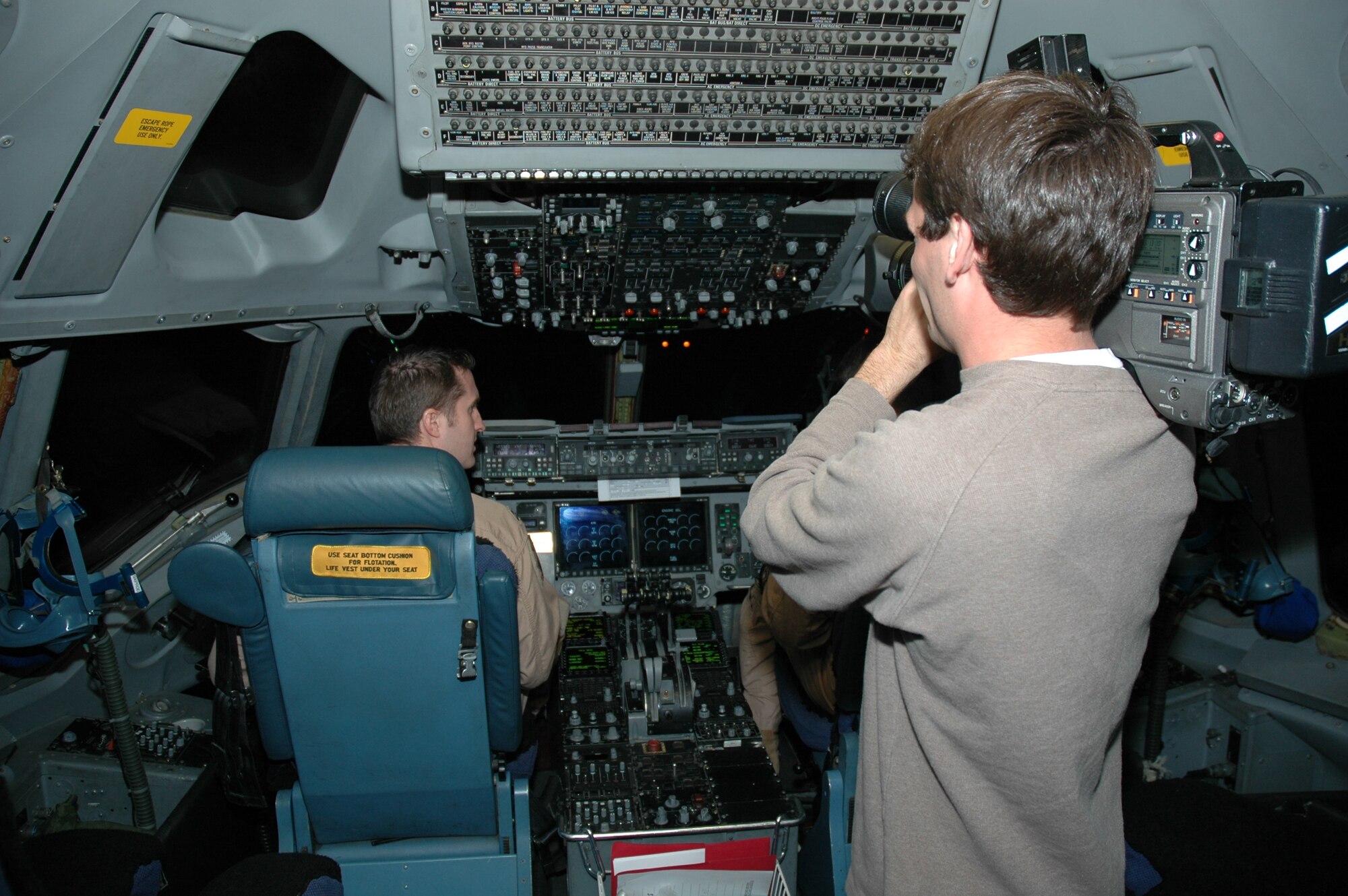 WCBD-TV (News Channel 2) Photojournalist, Jonah Jabbour films aircrew members assigned to the 300th Airlift Squadron, Charleston AFB, S.C. as the crew prepares to leave for Germany and Iraq.  WCBD accompanied the 315th Airlift Wing on a trip to feature deployed members of the wing.  (Photo by 1st Lt Wayne Capps)