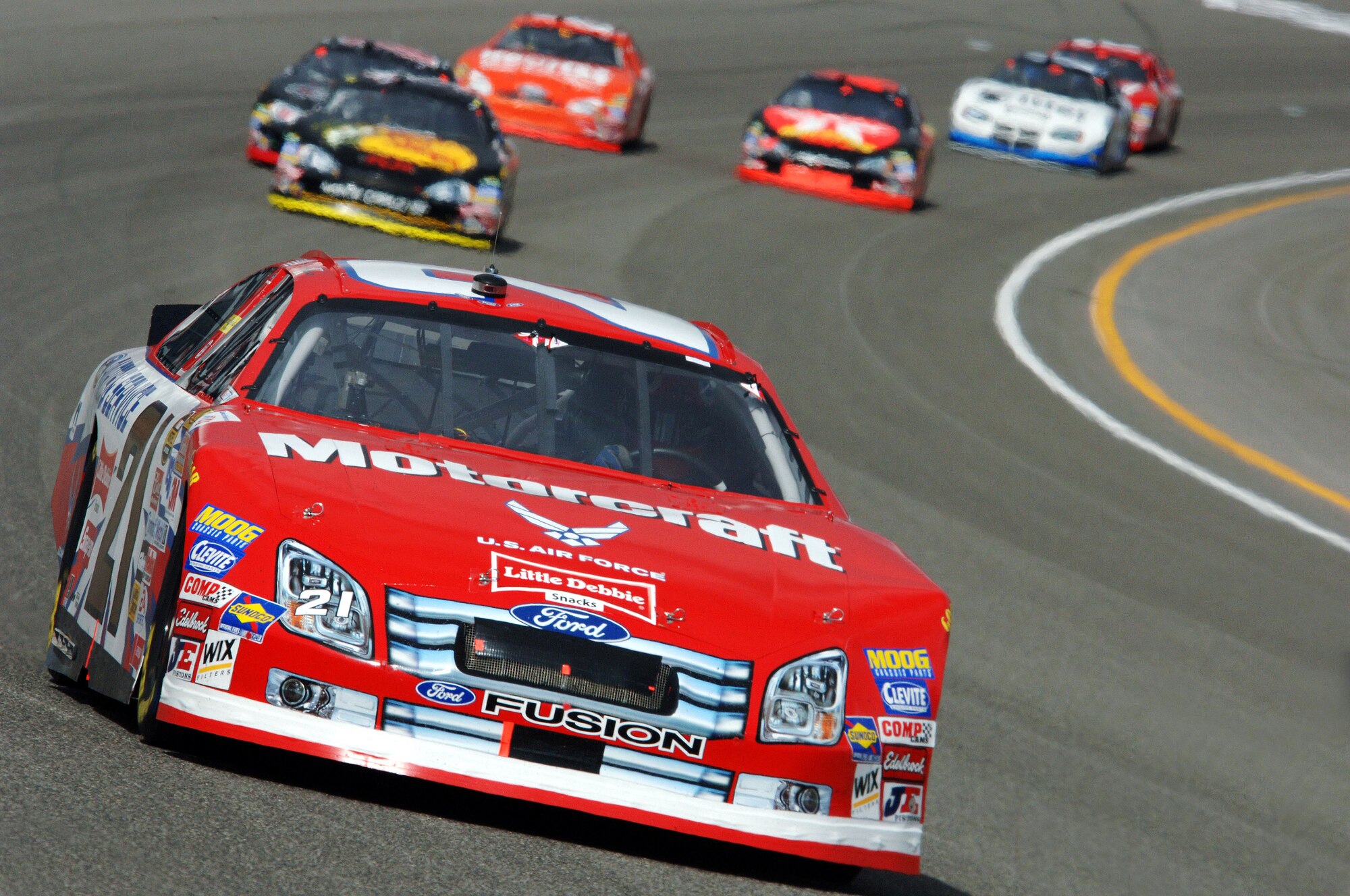 The U.S. Air Force #21 Motorcraft race car driven by Ken Schrader makes its way around the track during the NASCAR UAW-DaimlerChrysler 400 at the Las Vegas Motor Speedway, Las Vegas, Nev., Sunday, March 12, 2006.  The team's day ended with engine problems on lap 187, finishing in 41st place. (U.S. Air Force photo/Master Sgt. Robert W. Valenca)