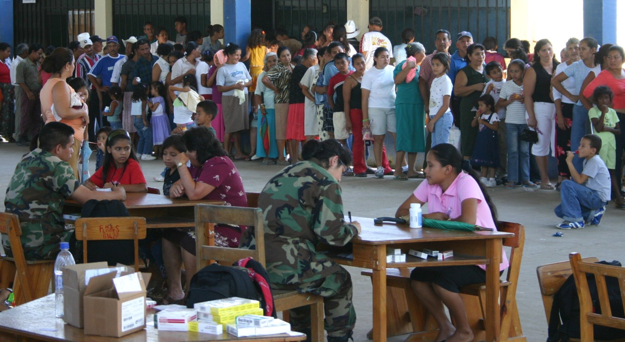 Patients line up to be seen at the medical readiness training exercise site in Santa Ana, Honduras. After being screened, patients are sent to the appropriate specialty care areas. The Air Force medical team saw more than 1,100 patients in the first two days of their four-day visit. (U.S. Air Force photo/Capt. Mike Chillstrom)

