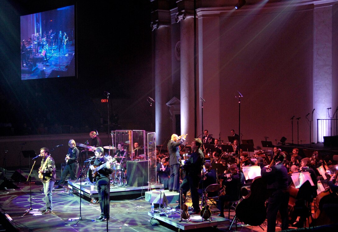 Country music star Mark Wills performs with members of the US Air Force Band capping off its 40th anniversary season of their guest artist series, Sunday, Mar. 5, 2006, in Washington, D.C. Also performing at the concert were members of the Air Force Reserve Pipe Band from Robins Air Force Base, Ga. (U.S. Air Force photo/Master Sgt. Jim Varhegyi)