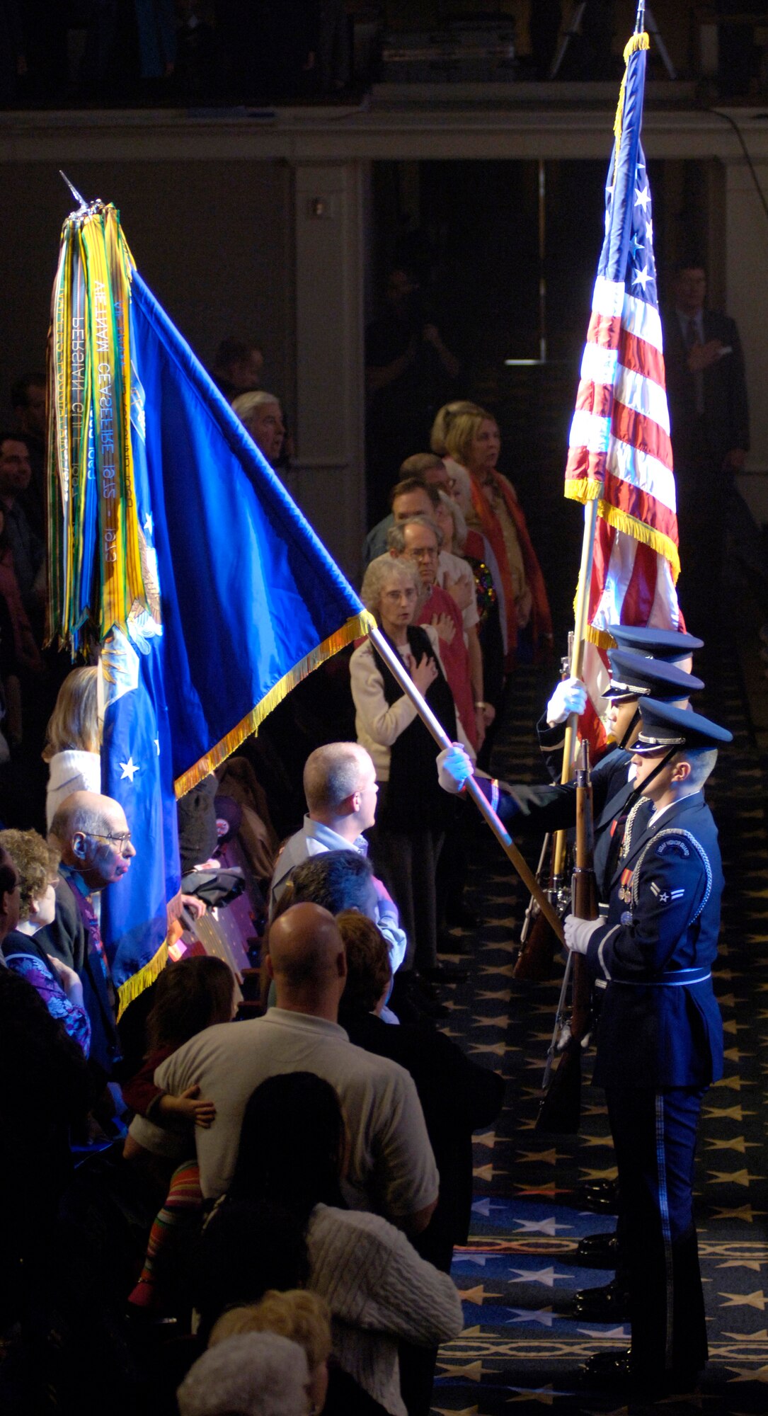 Members of the US Air Force Honor Guard post the colors at the start of the US Air Force Band's final concert of this season's guest artist series, Sunday, Mar. 5, 2006, in Washington, D.C. The Air Force band capped off the 40th anniversary of hosting the series by performing with country music star Mark Wills, along with the Air Force Reserve Pipe Band from Robins Air Force Base, Ga. (U.S. Air Force photo/Master Sgt. Jim Varhegyi)