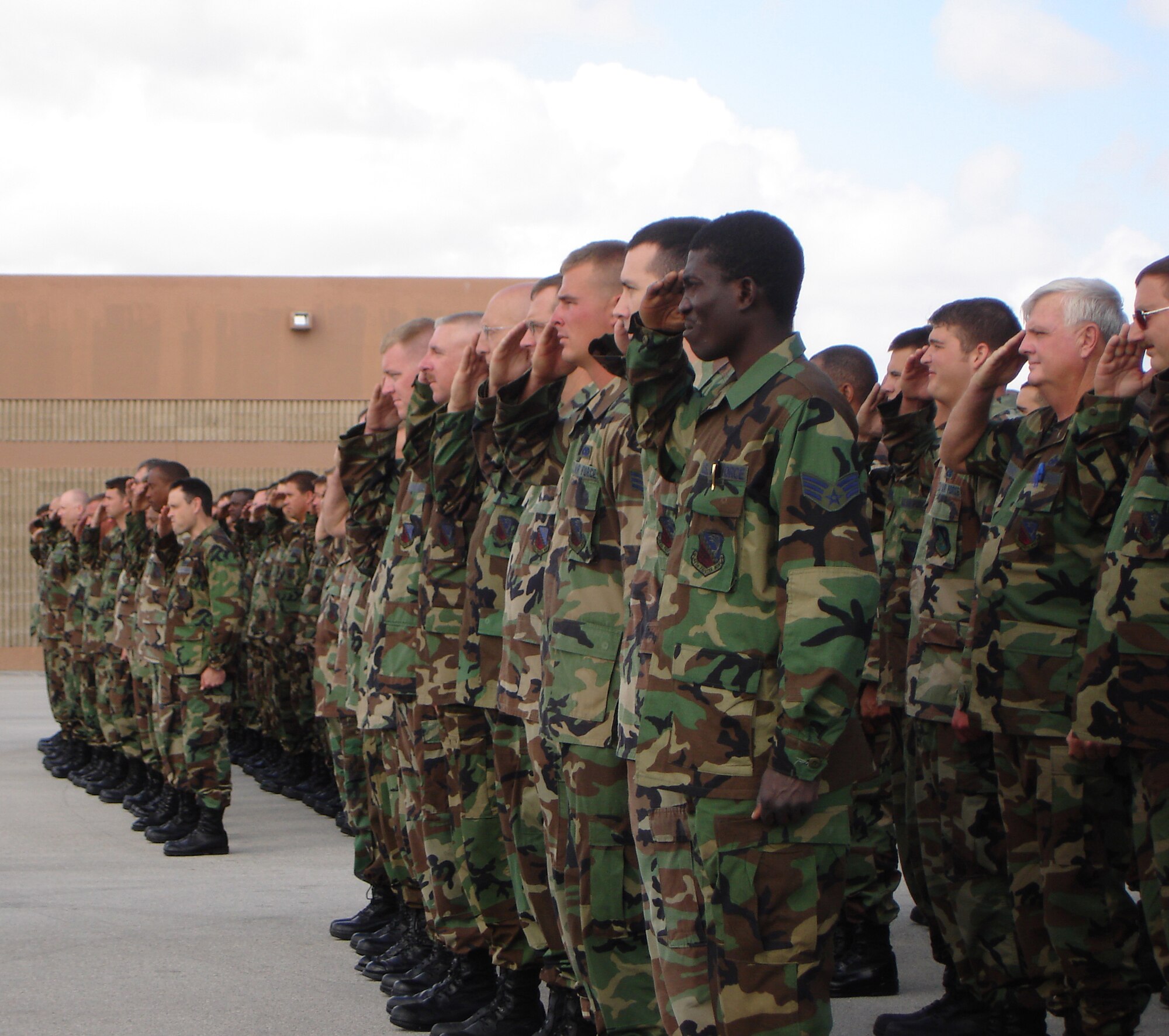 Airmen from the 482nd Aircraft Maintenance Squadron  present arms during the  482nd Maintenance Group’s change of command ceremony on March 11.  During the ceremony Col. Herb Brown relinquished command to Col. T. Glenn Davis.  The maintainers provide direct support  to the 93rd Fighter Squadron’s 17 F-16s (U.S. Air Force Reserve photo by Lt. Col. Tom Davis).