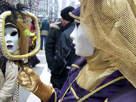 Partygoers dress in fancy costumes and walk around the streets posing for pictures during Carnevale (Photo by Senior Airman Sarah Gregory)
