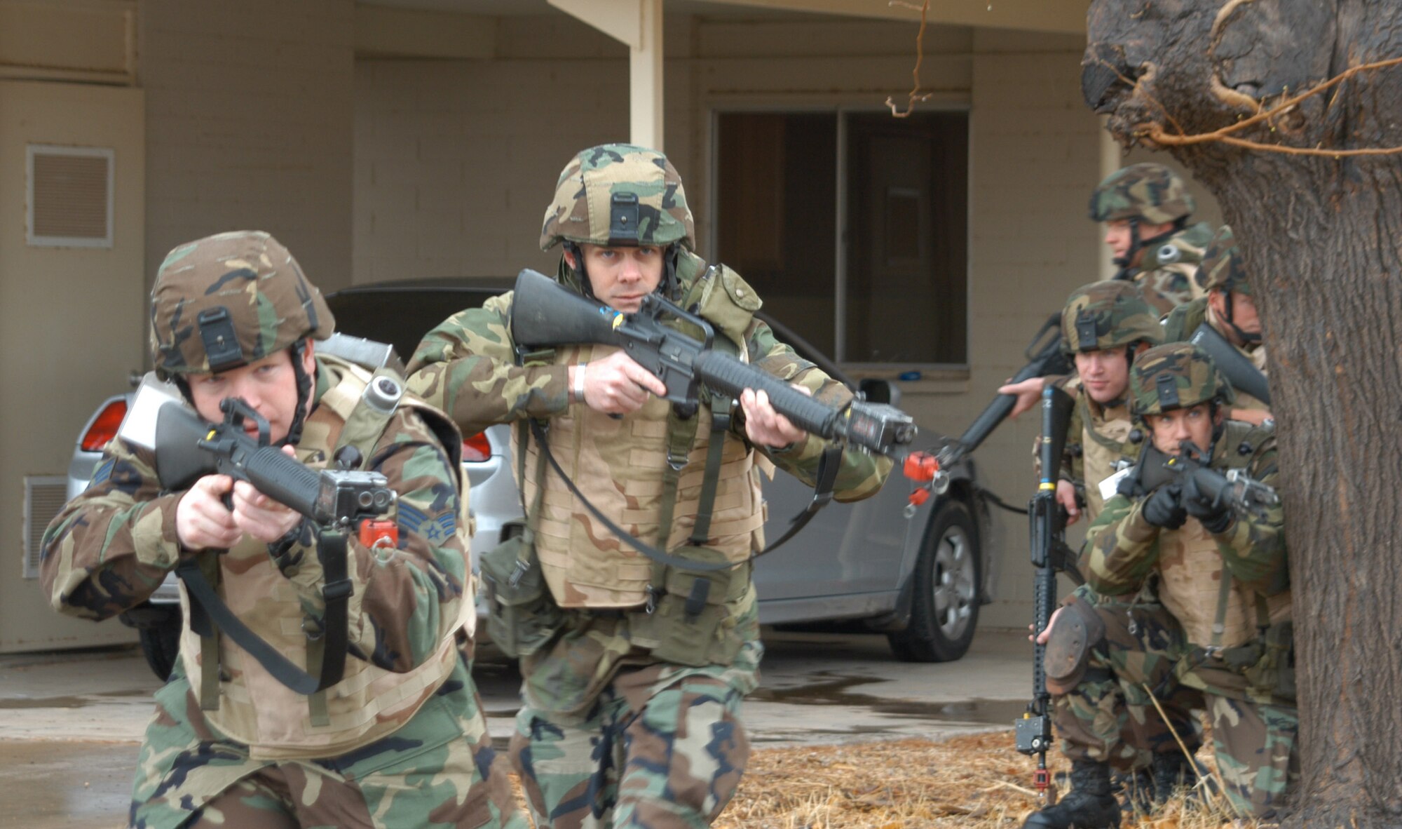 The 944th Security Forces "Desert Dawgs" Squadron exercise building search tactics during Operation "Dawg Pound" March 11. The 944th SFS members went through base housing searching for and clearing out enemy forces while safeguarding civilian personnel. (U.S. Air Force Reserve photo by Tech. Sgt. Barbara Plante)