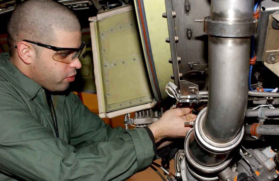 Airman 1st Class Luisel Rolon, 319th Maintenance Squadron, works on a jet engine of a KC-135 during a periodic inspection