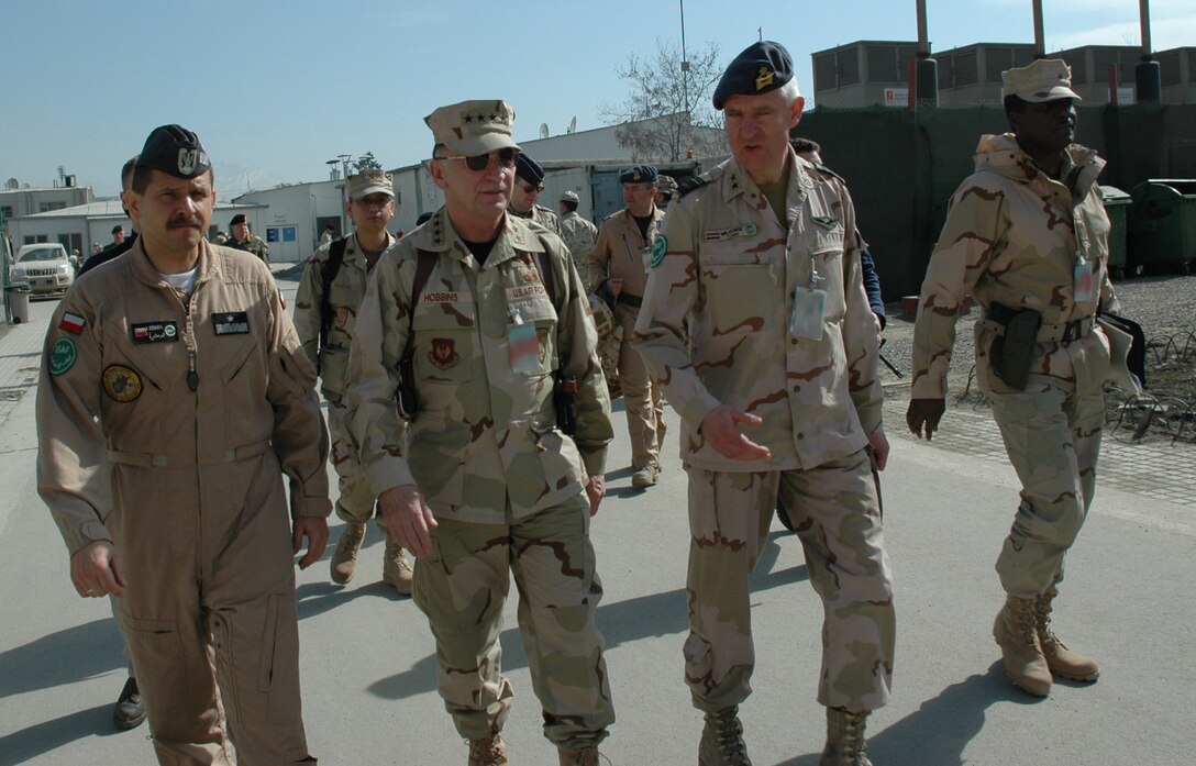 Gen. Tom Hobbins, U.S. Air Forces in Europe commander (second from left), and Chief Master Sgt. Gary Coleman, USAFE command chief master sergeant (far right), met with Brig. Gen. Piotr Lusnia, Air Task Force commander (left) and Maj. Gen. Jaap Willemse, International Security Assistance Force deputy commander during a trip to ISAF headquarters Feb. 9. (Photo by 1st Lt. Elizabeth Culbertson)