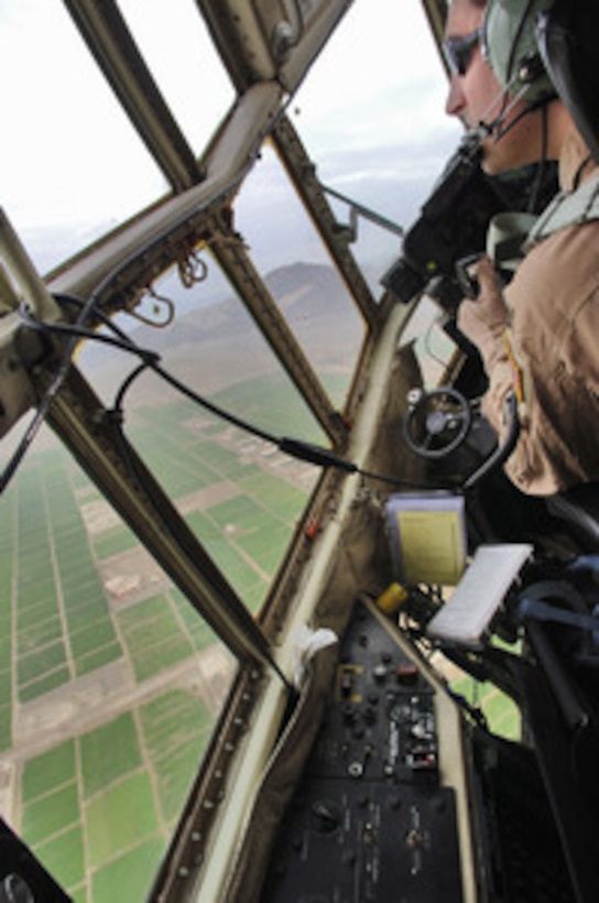 The crew of a C-130H2 Hercules aircraft make tactical turns as they leave Bagram Air Base, Afghanistan, for a flight to Forward Operations Base Salearno, Afghanistan, on March 8, 2006. The aircraft and crew are assigned to the 185th Airlift Squadron, Will Rogers World Airport, Oklahoma Air National Guard and are deployed to the 774th Expeditionary Airlift Squadron, Bagram Air Base. 