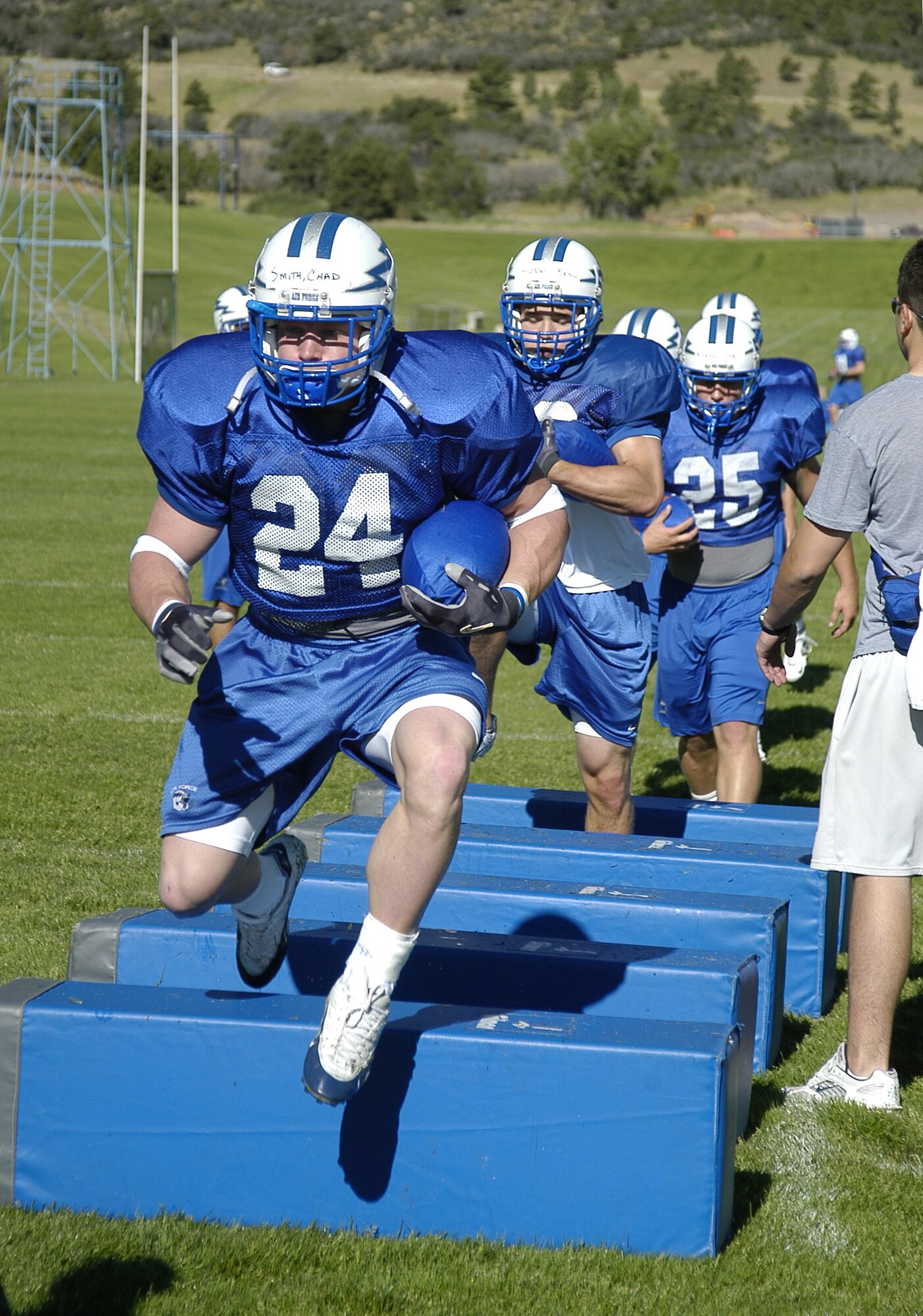 Falcons sophomore halfback Chad Smith leads fellow backs through an agility drill. Smith ran 34 times for 190 yards and one touchdown in the Falcons' triple-option rushing attack last season. (U.S. Air Force photo/John Van Winkle) 