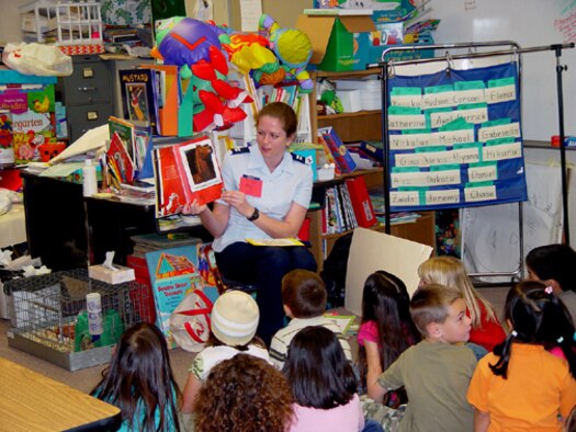 TORRANCE, Calif. -- Capt. Mary Danner, Air Force Public Affairs Entertainment Liaison Office, reads Duck on a Bike to a class at Carr Elementary School here March 2. The captain was among approximately 30 Airmen reading to elementary students during the Read Across America event held in local schools.